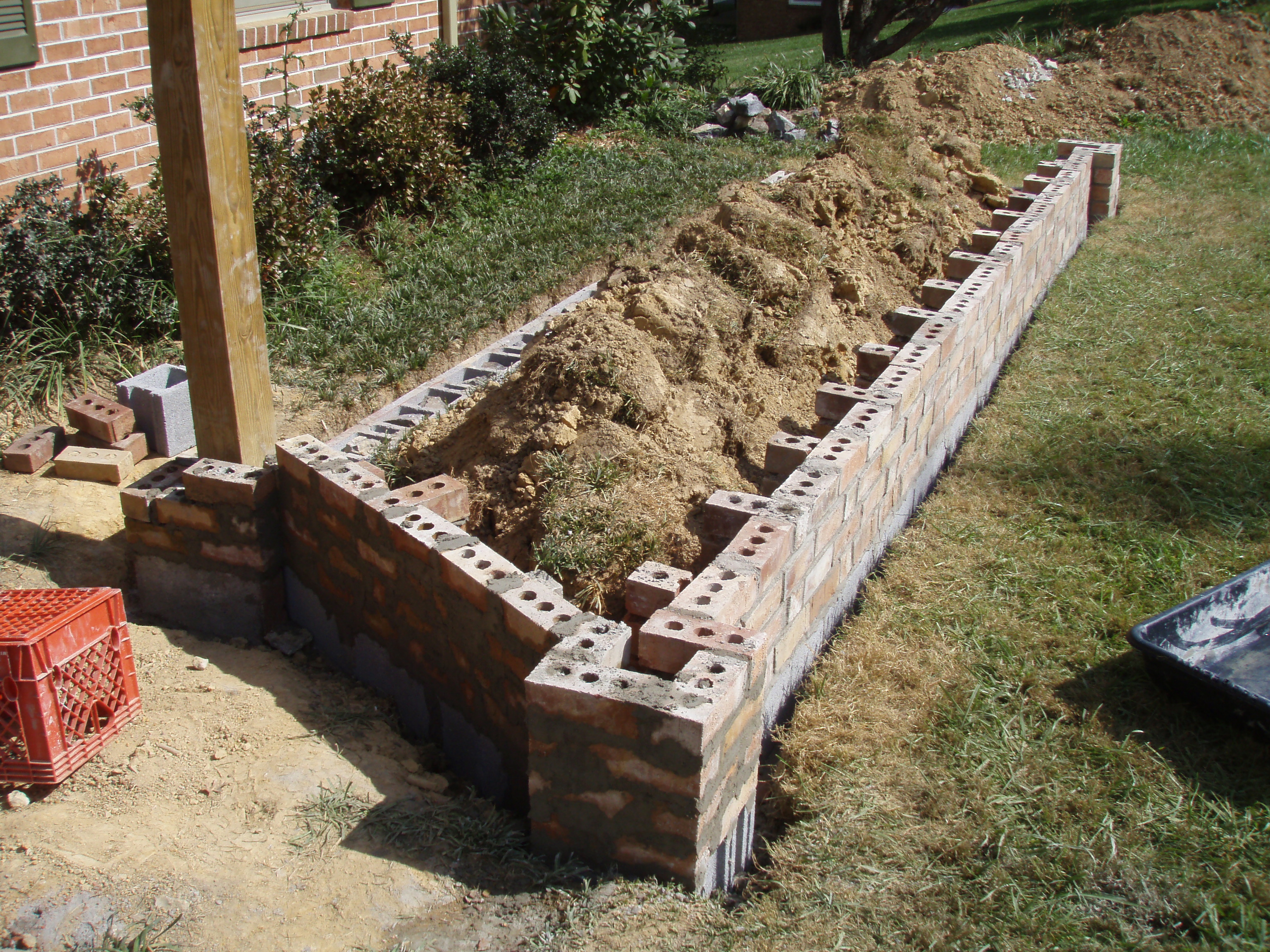 front gable porch with brick raised garden