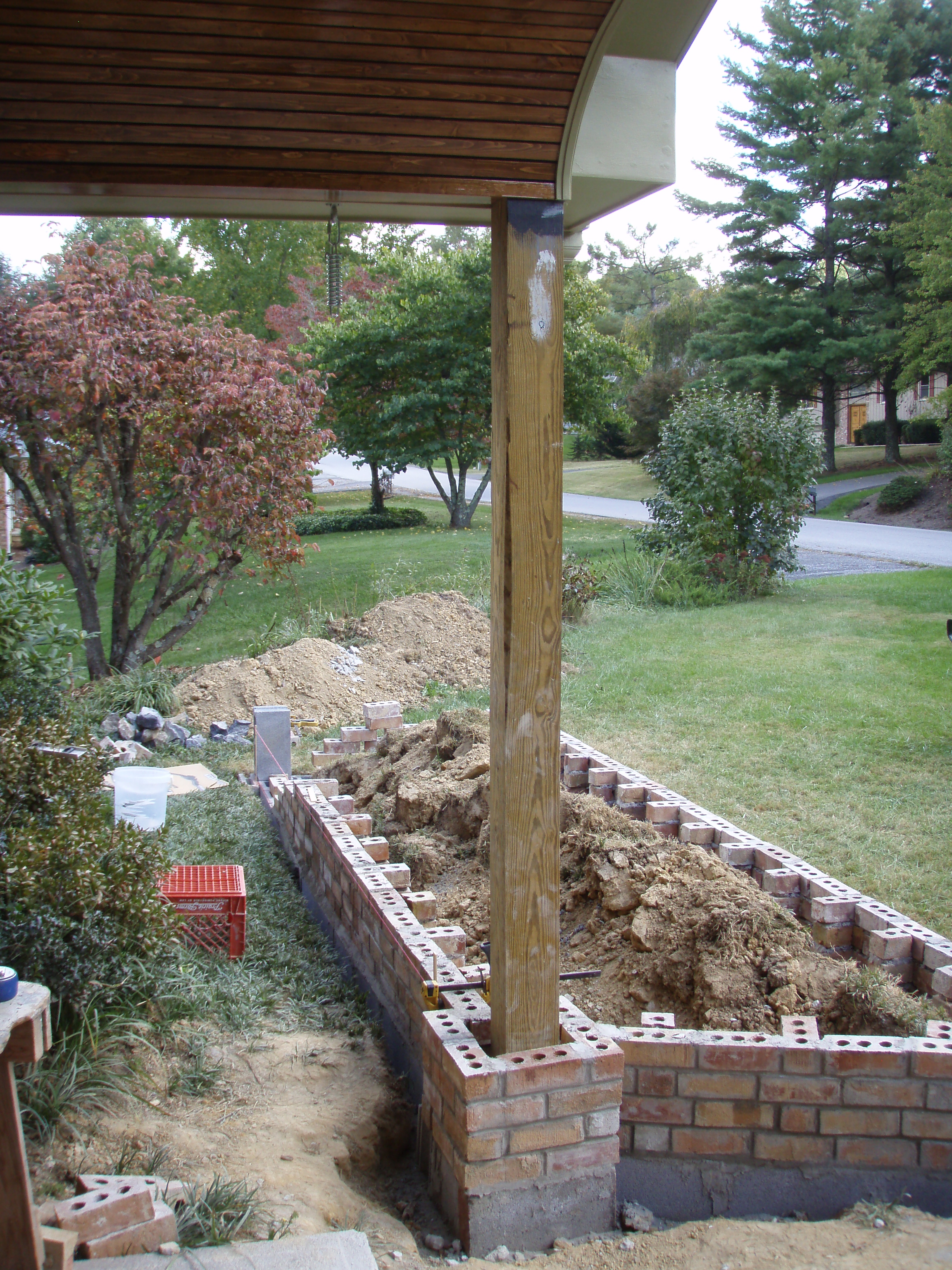 front gable porch with brick raised garden