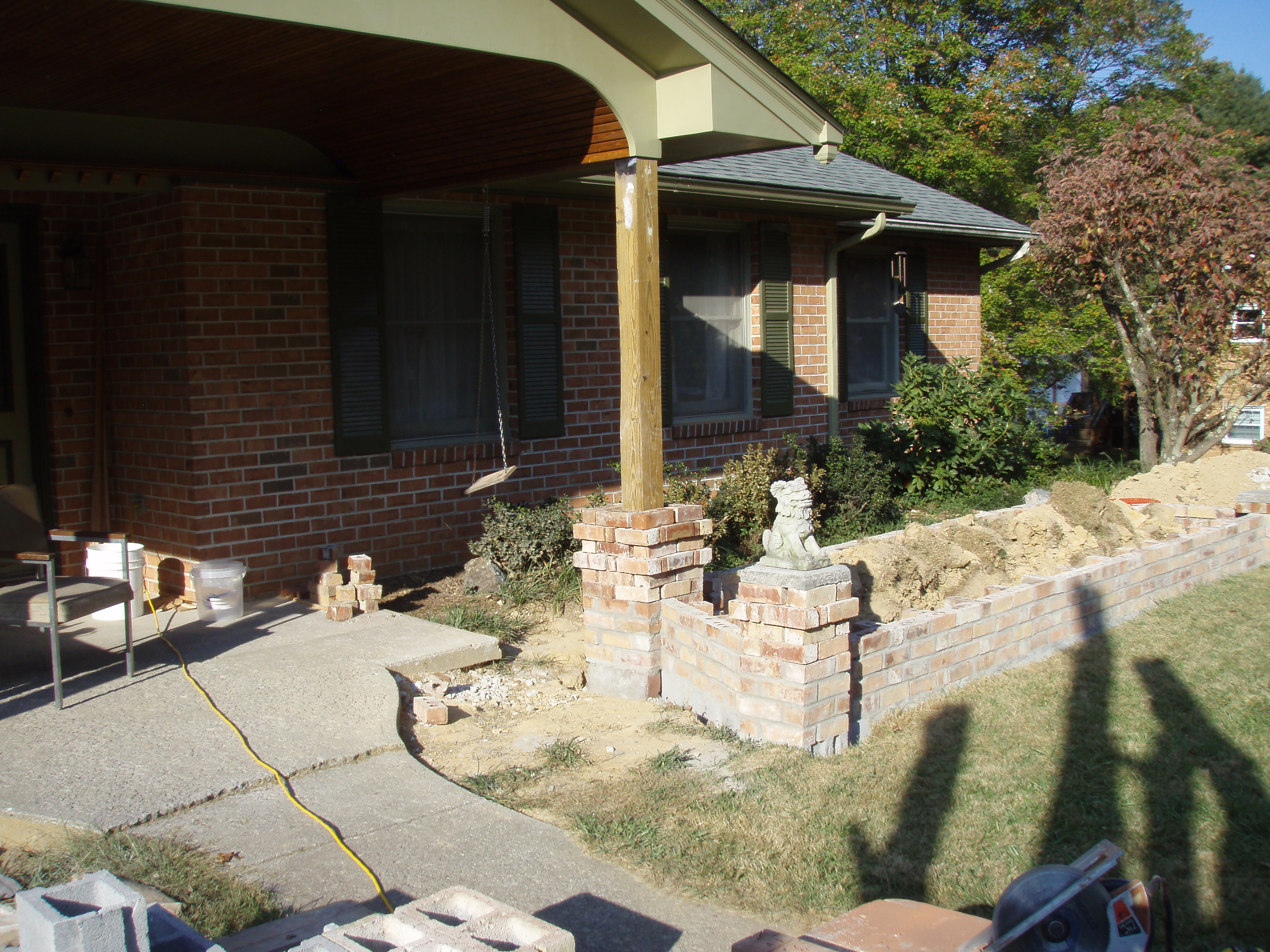 front gable porch with brick raised garden