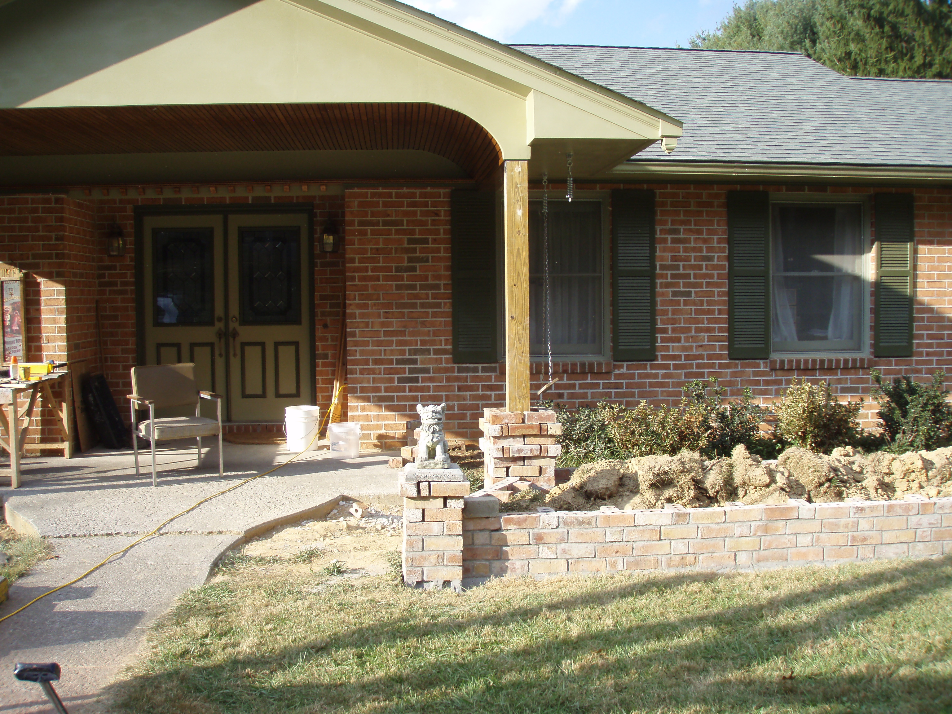 front gable porch with brick raised garden