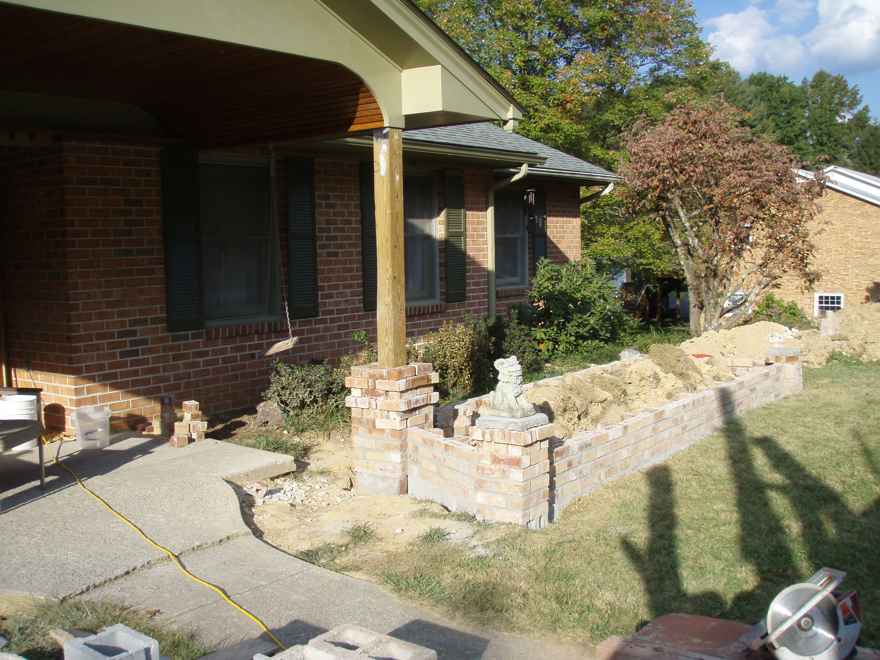 front gable porch with brick raised garden