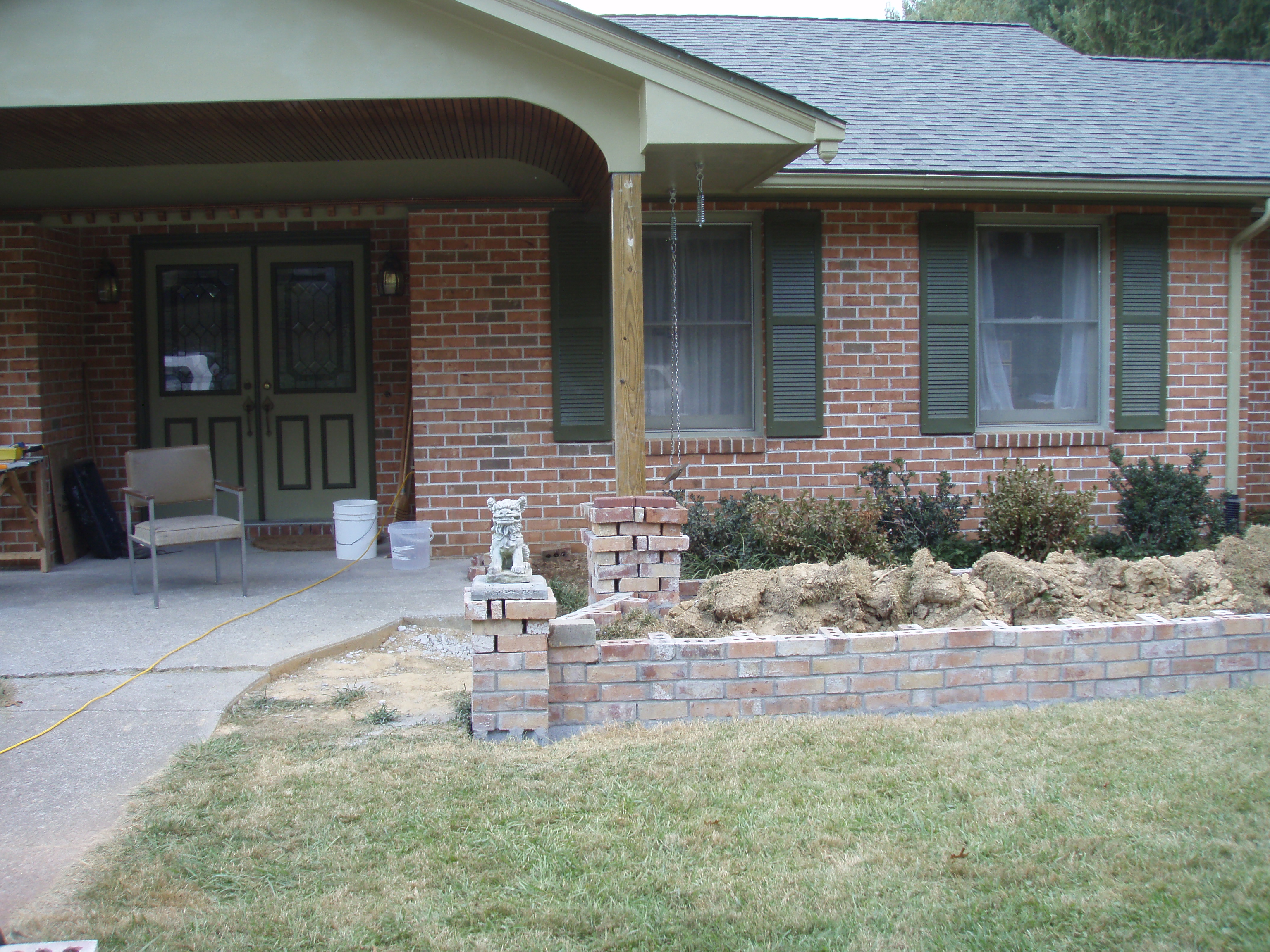 front gable porch with brick raised garden