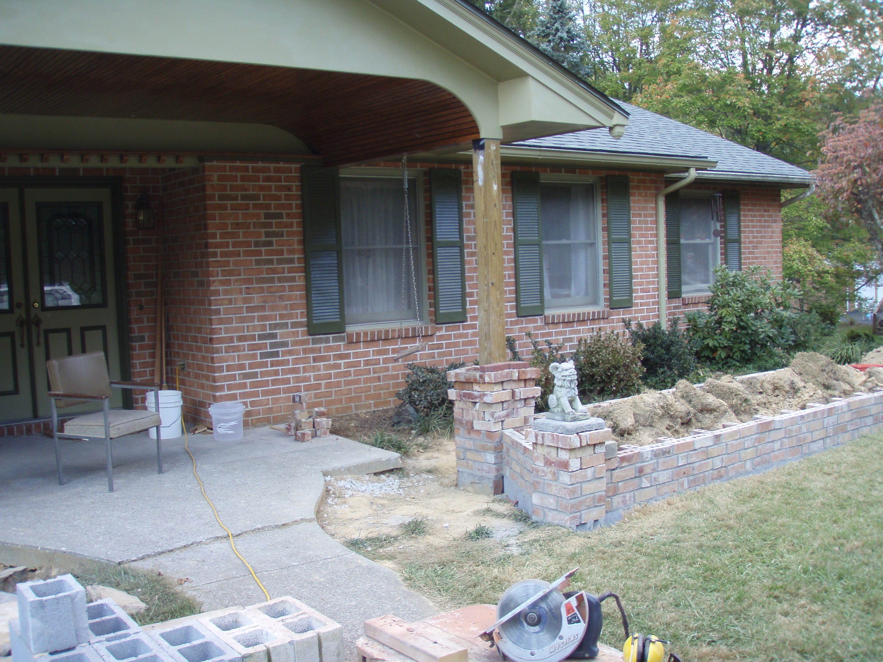 front gable porch with brick raised garden