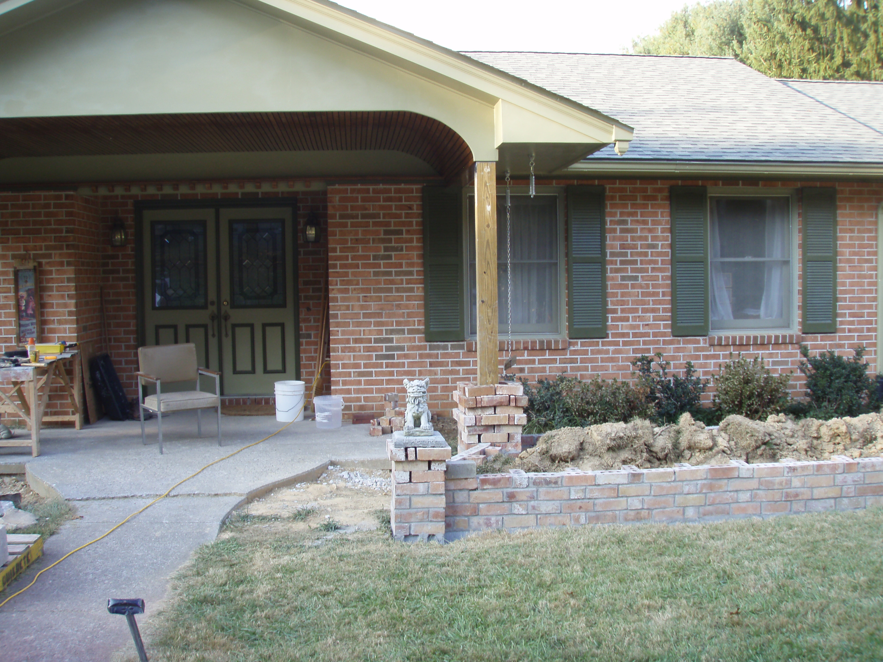 front gable porch with brick raised garden