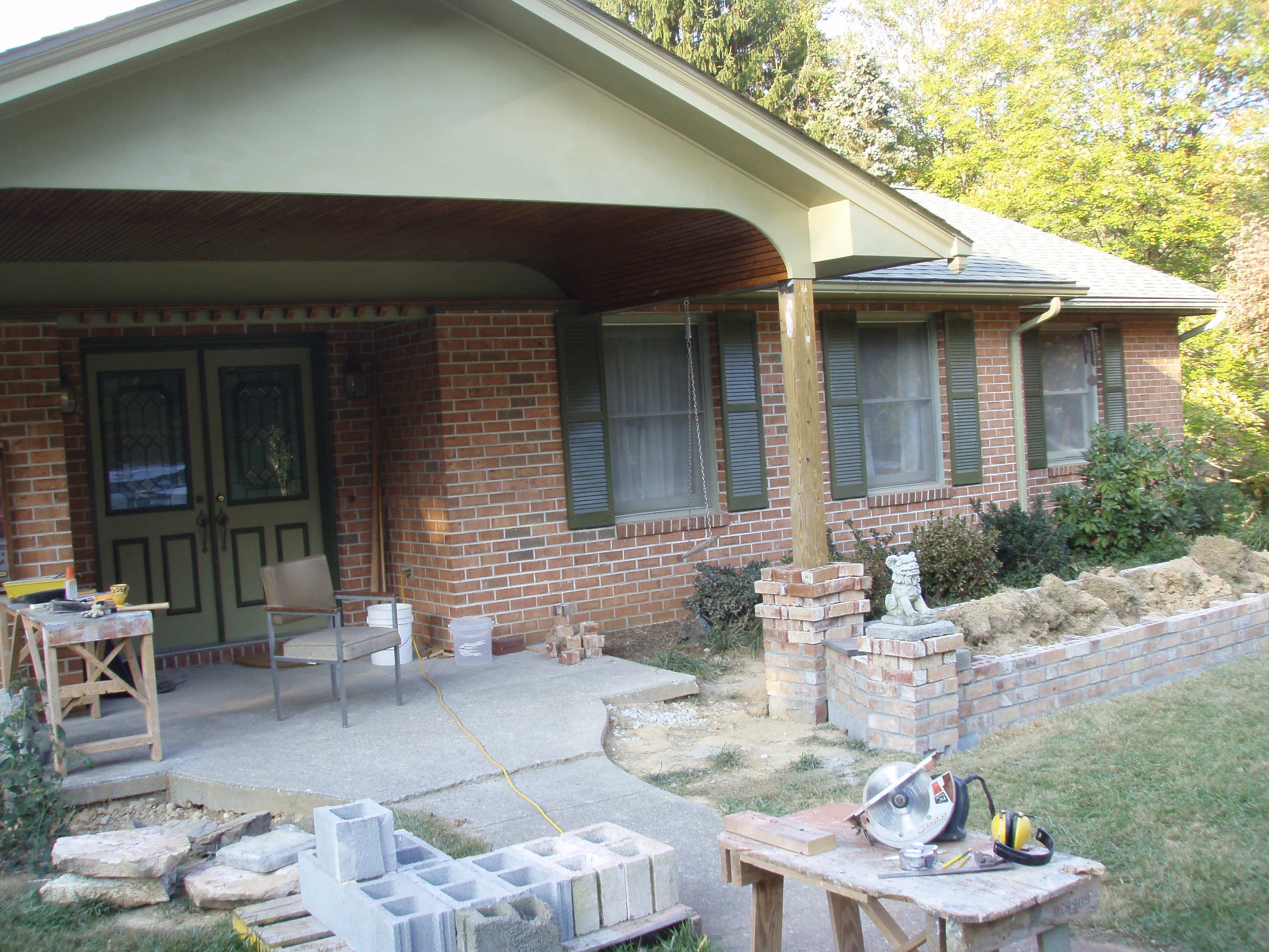 front gable porch with brick raised garden