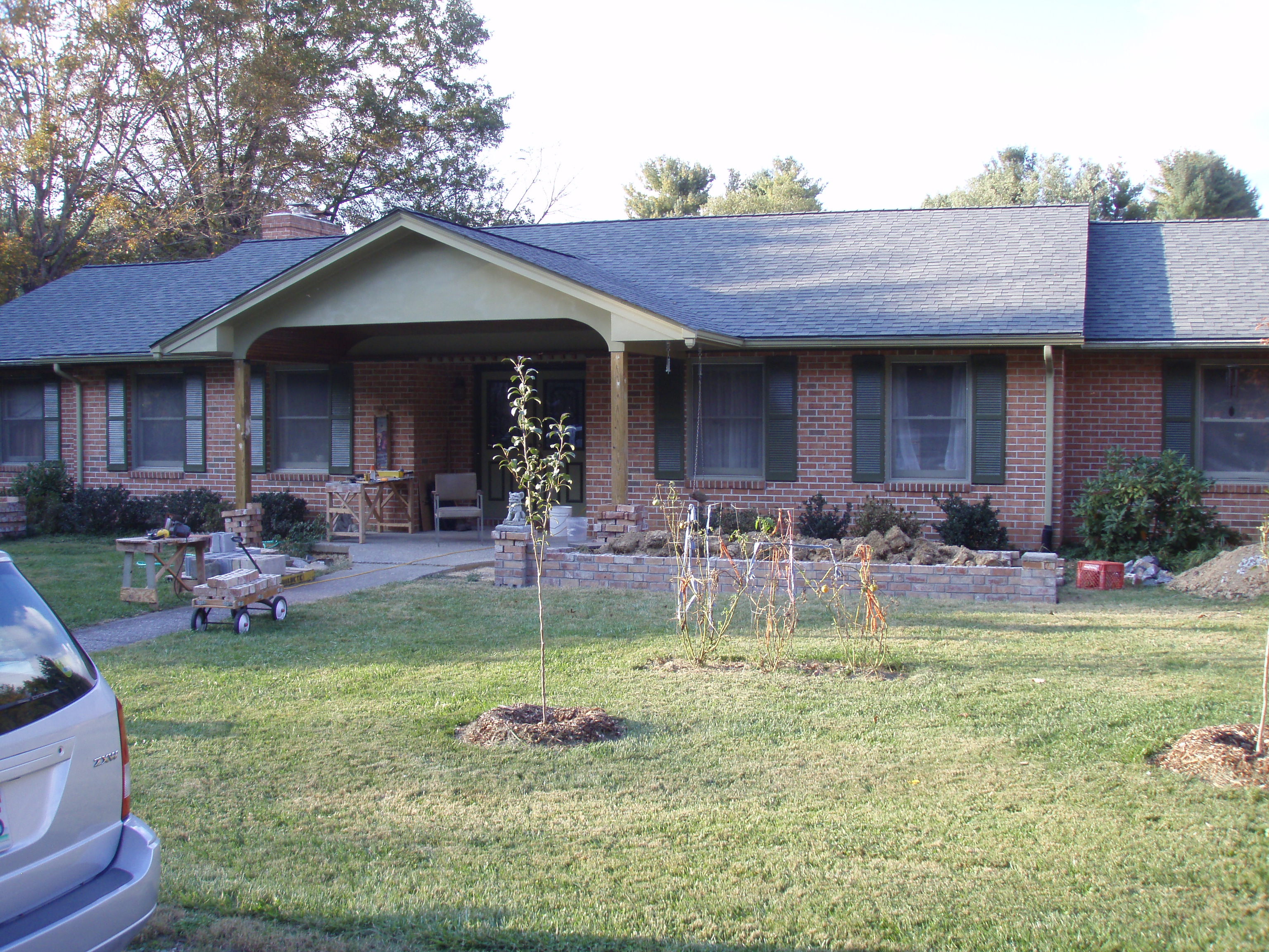 front gable porch with brick raised garden