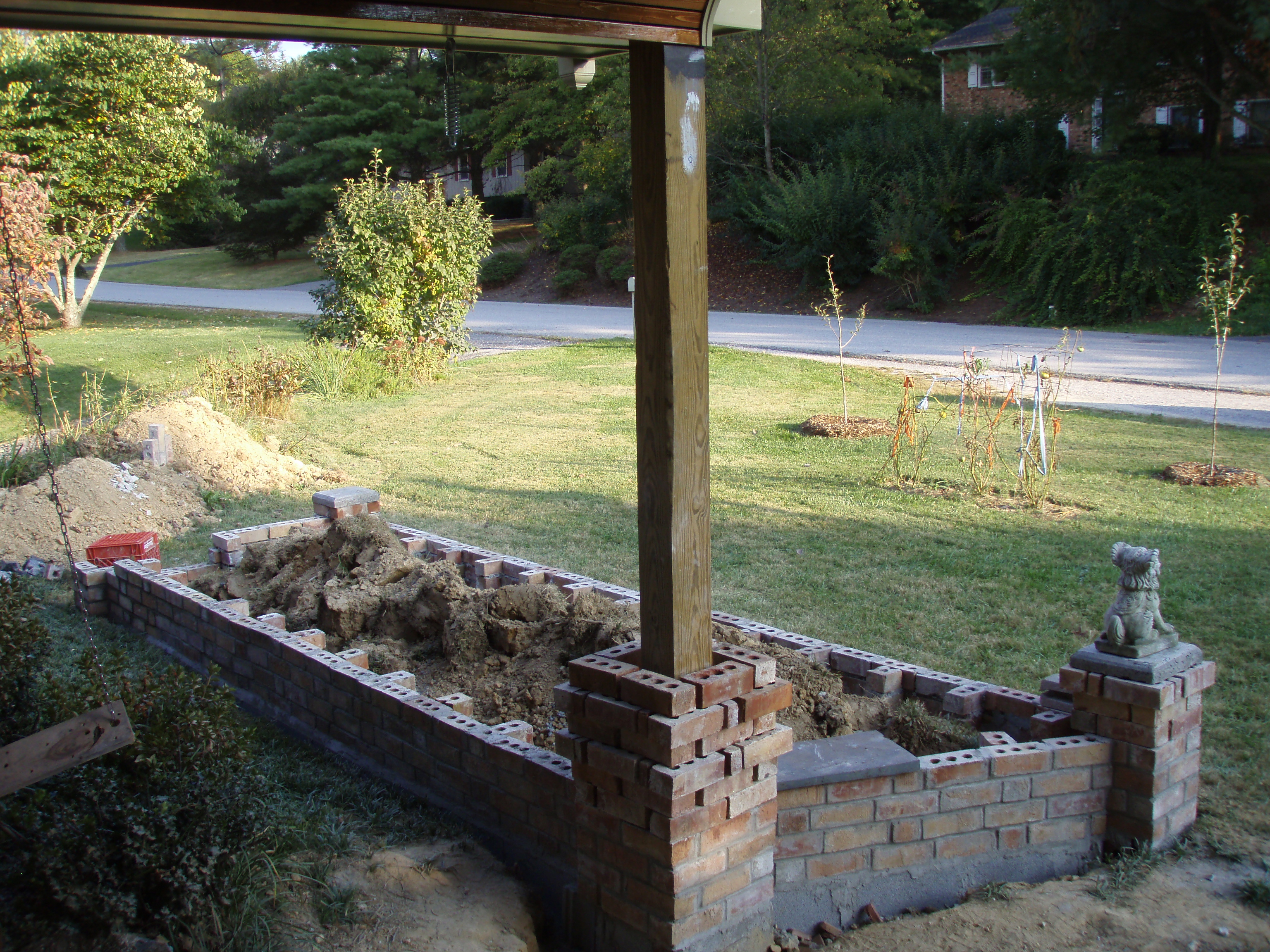 front gable porch with brick raised garden