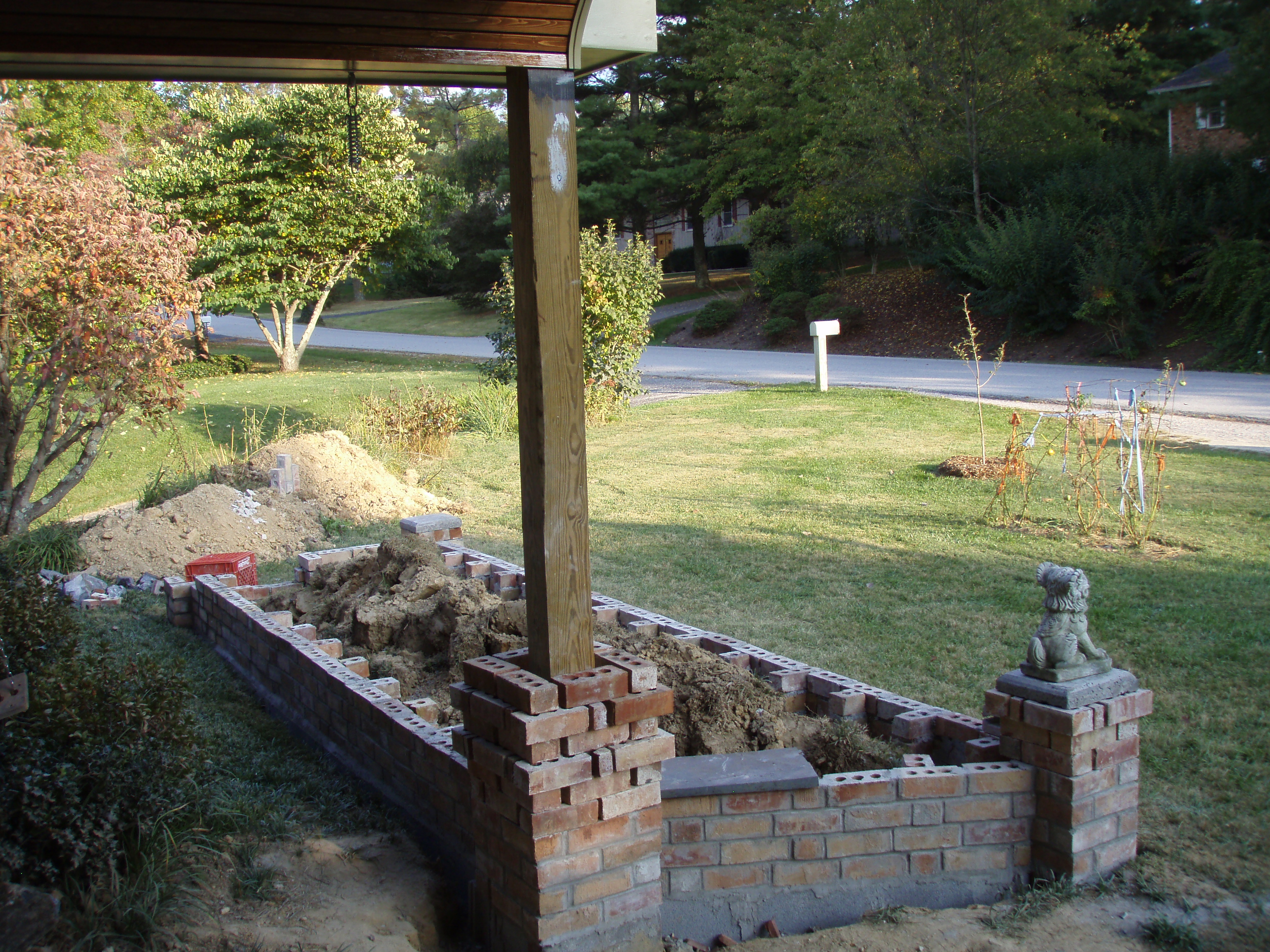 front gable porch with brick raised garden