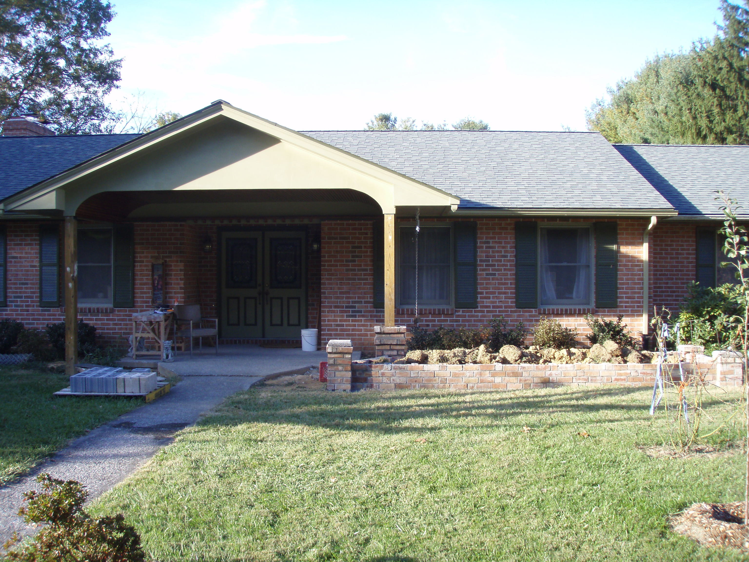 front gable porch with brick raised garden