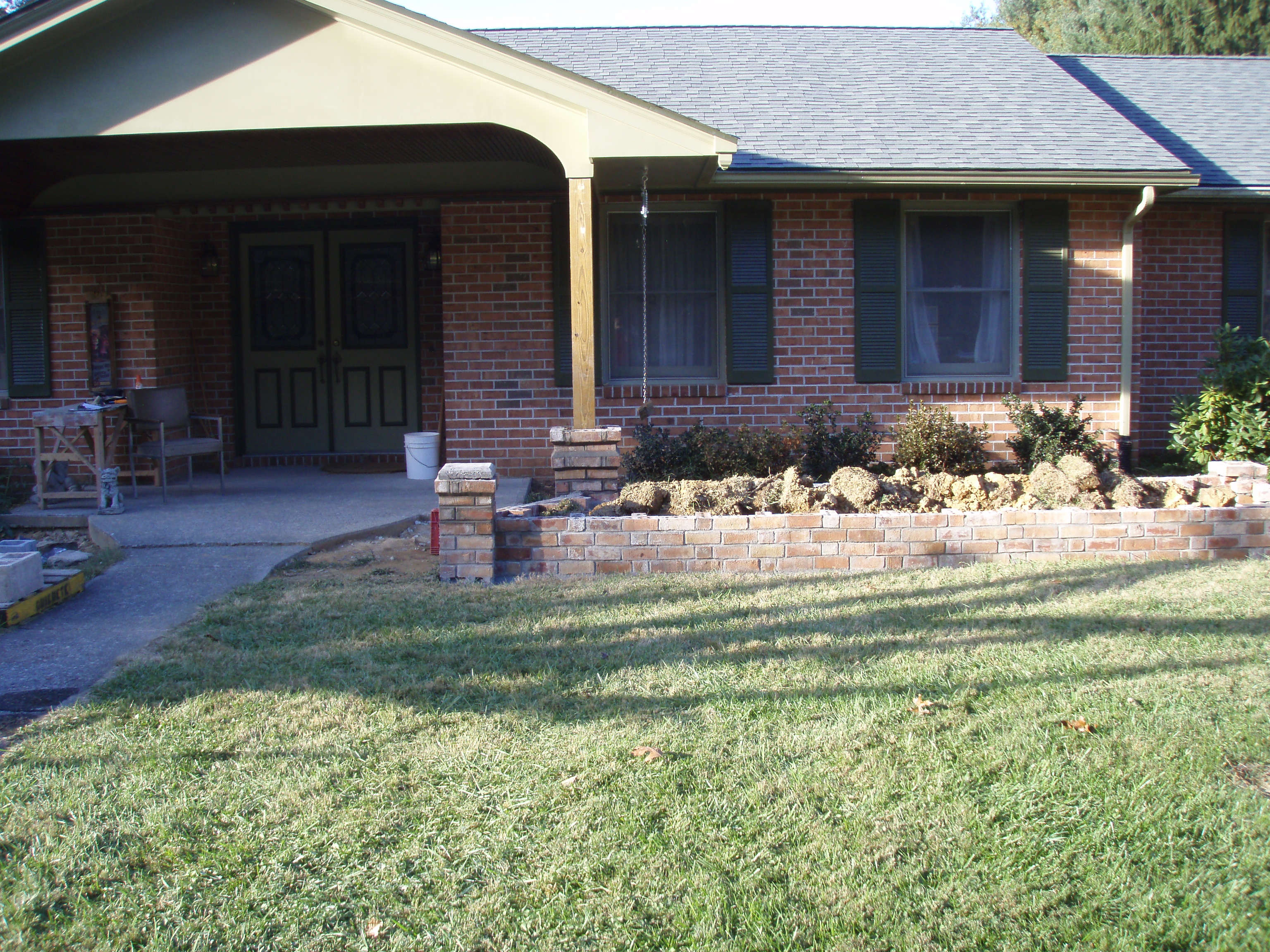 front gable porch with brick raised garden