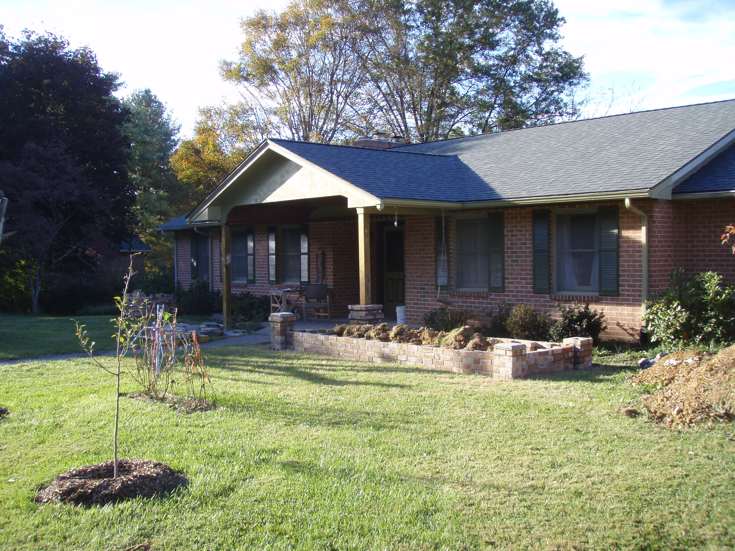 front gable porch with brick raised garden