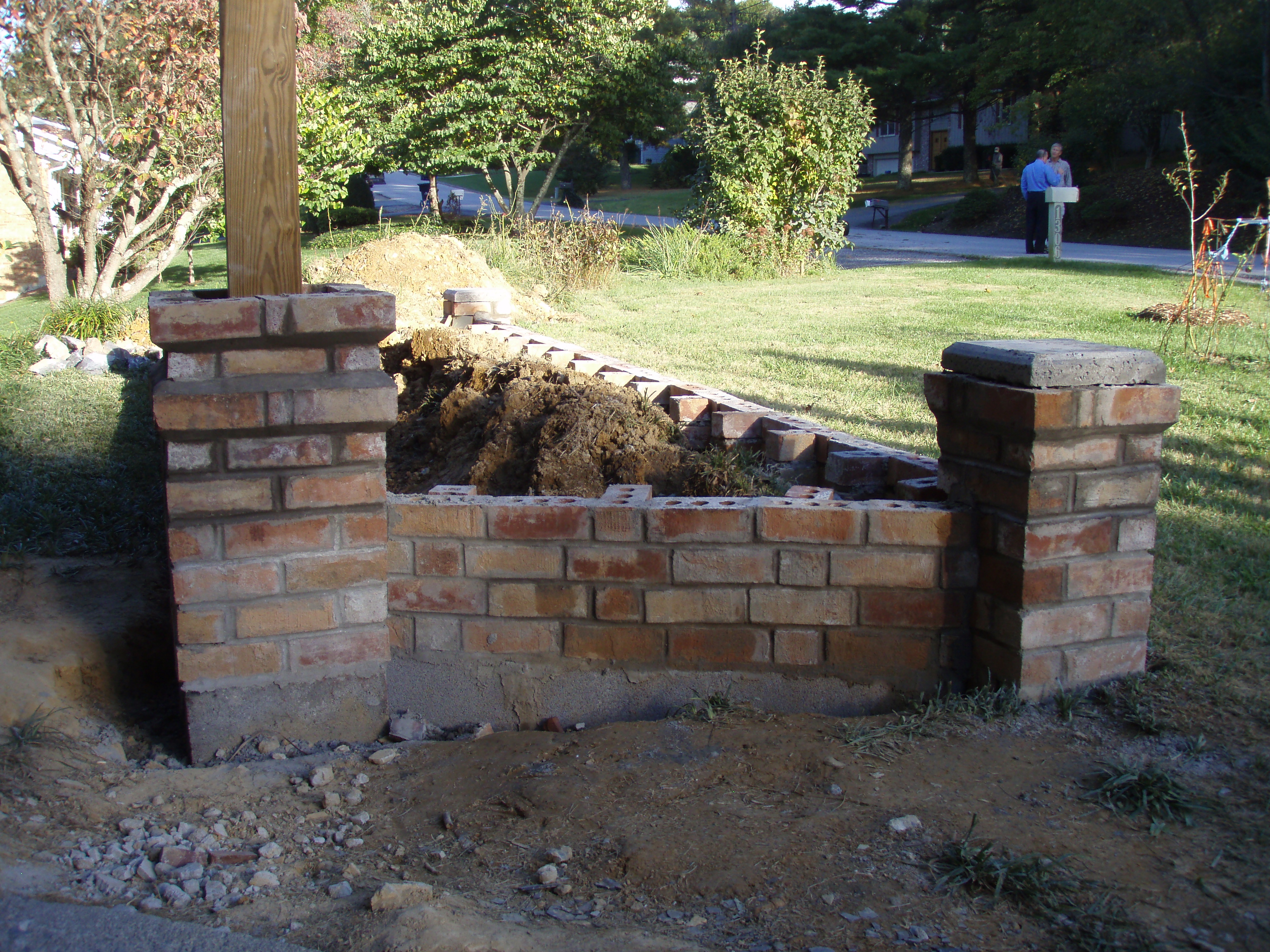 front gable porch with brick raised garden