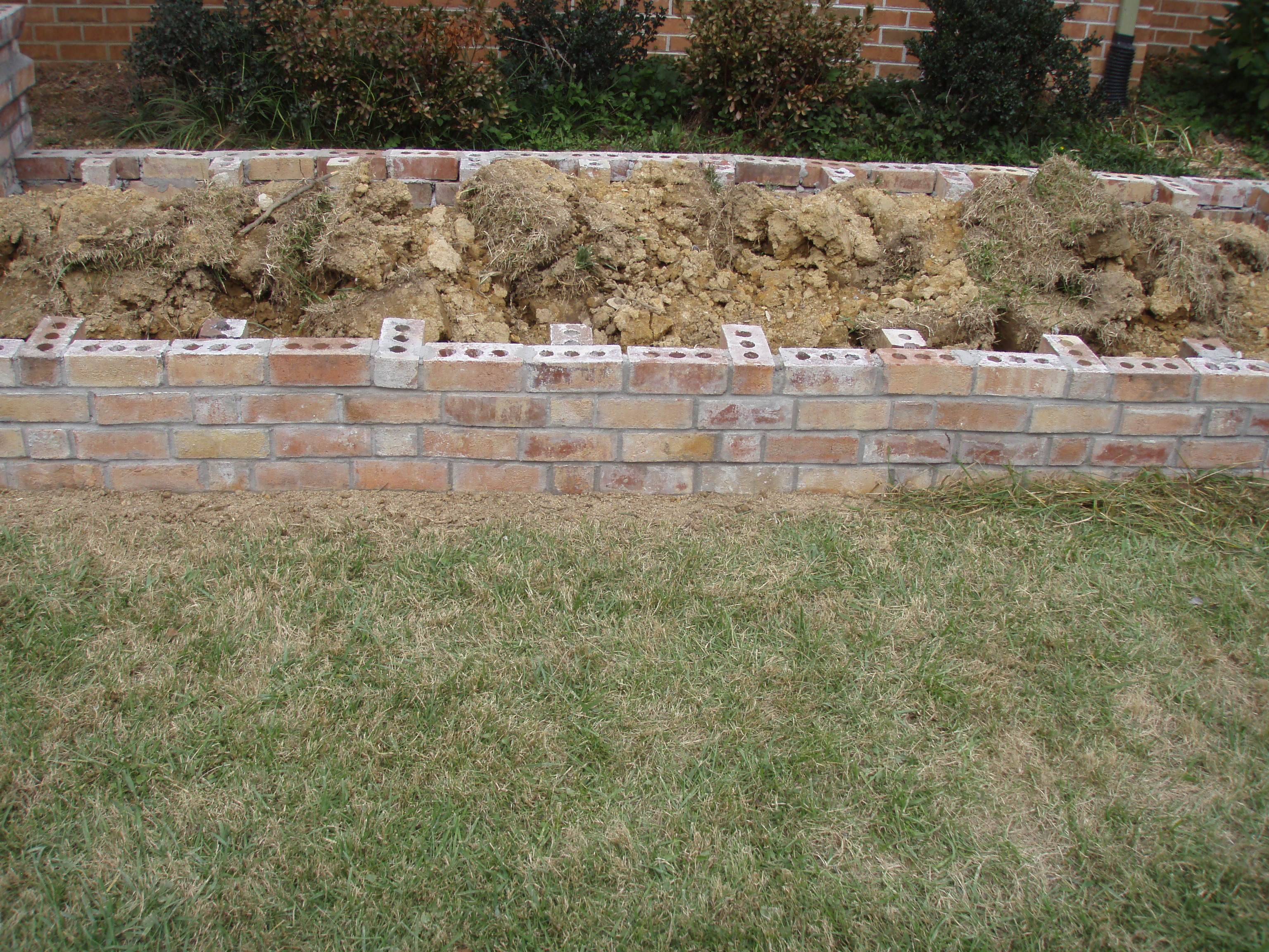 front gable porch with brick raised garden