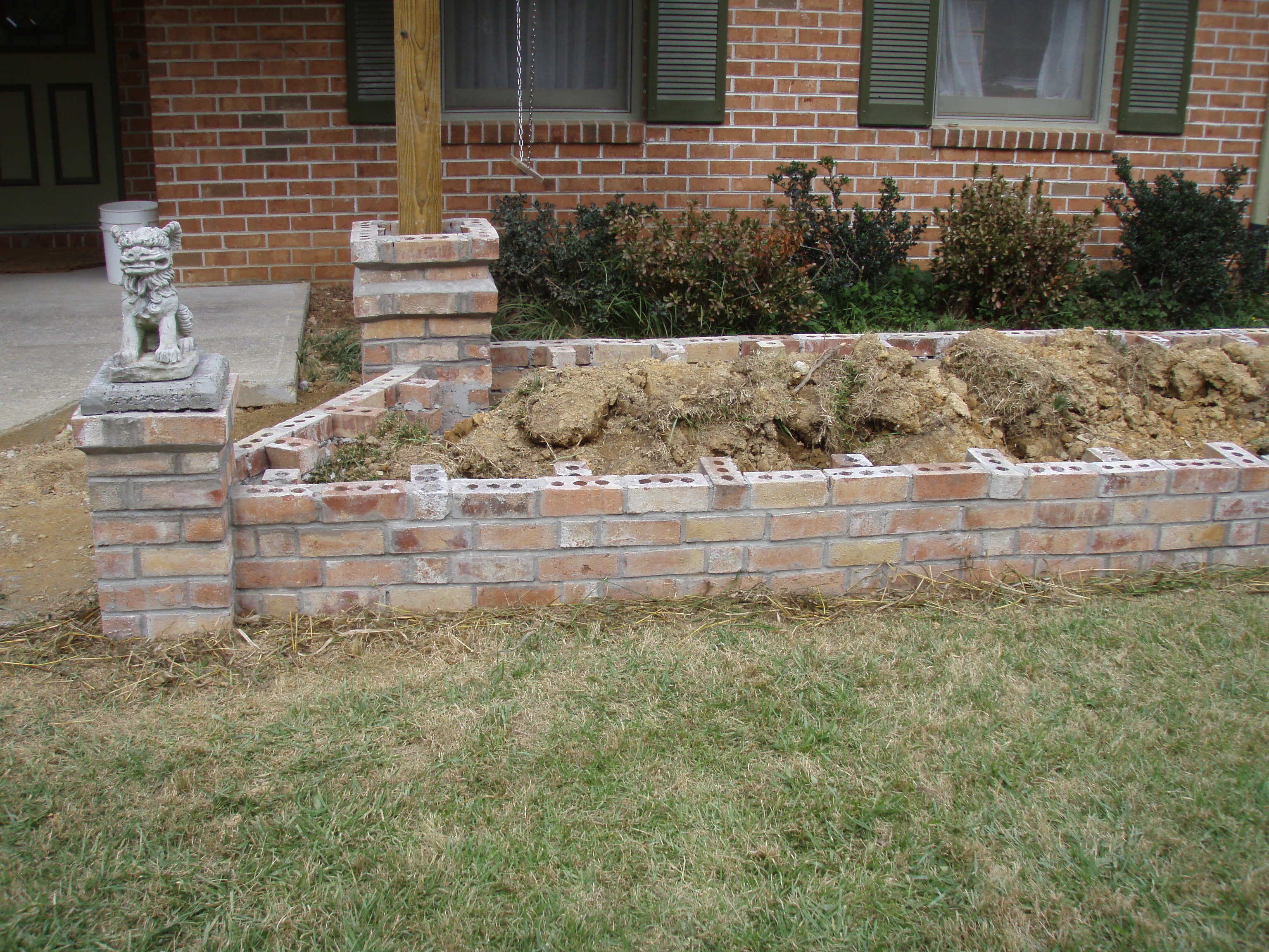 front gable porch with brick raised garden