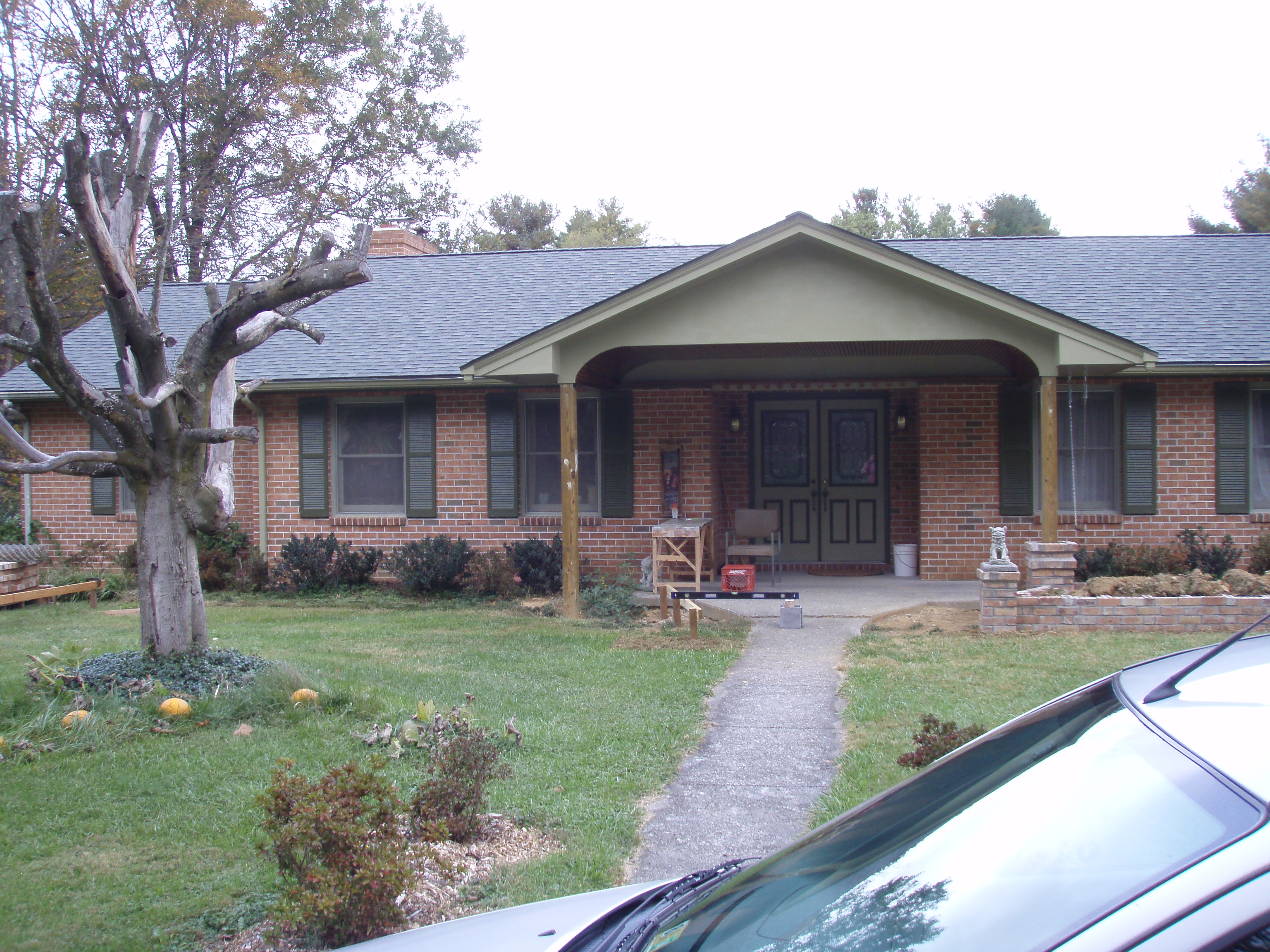 front gable porch with brick raised garden