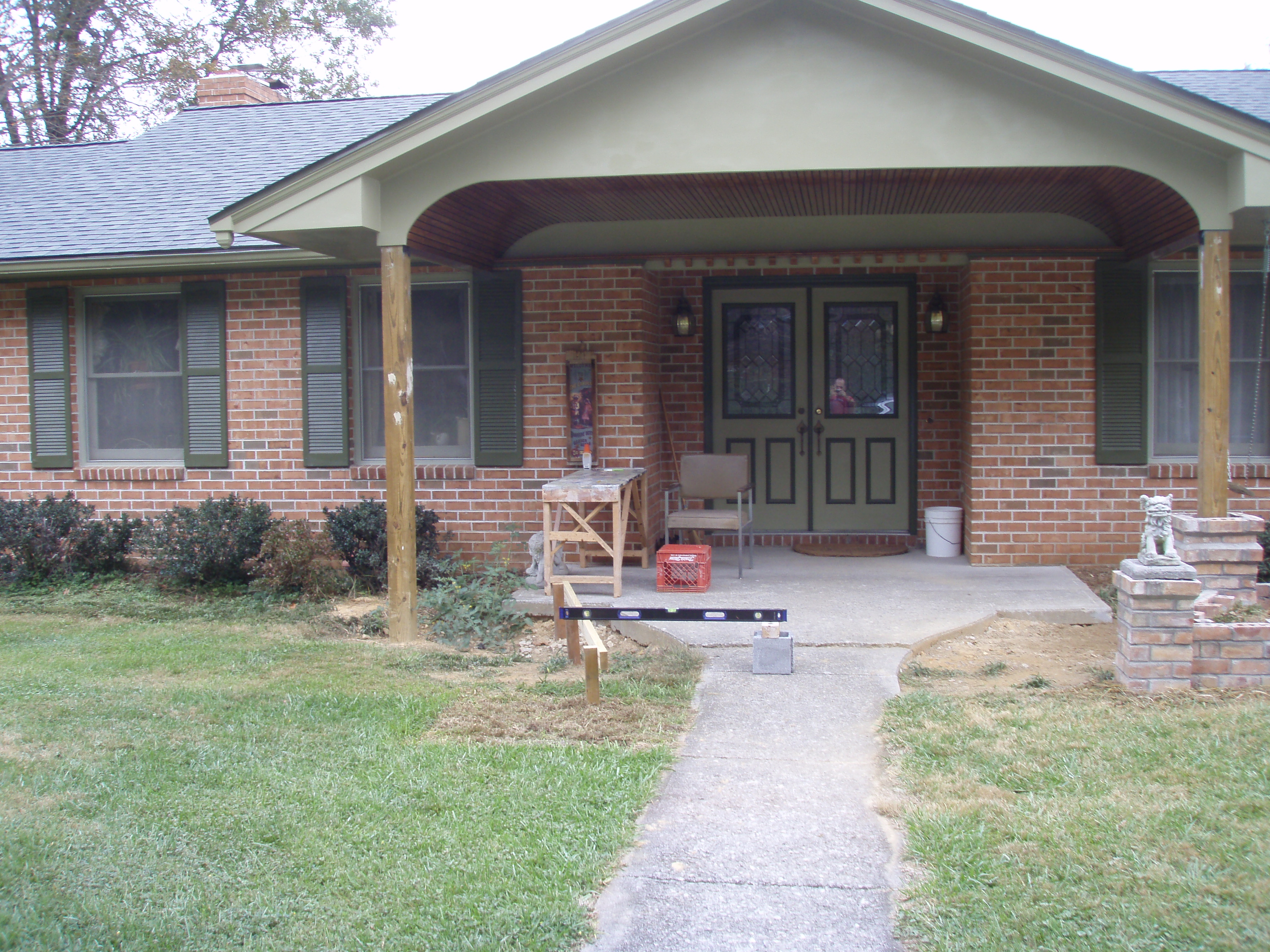 front gable porch with brick raised garden