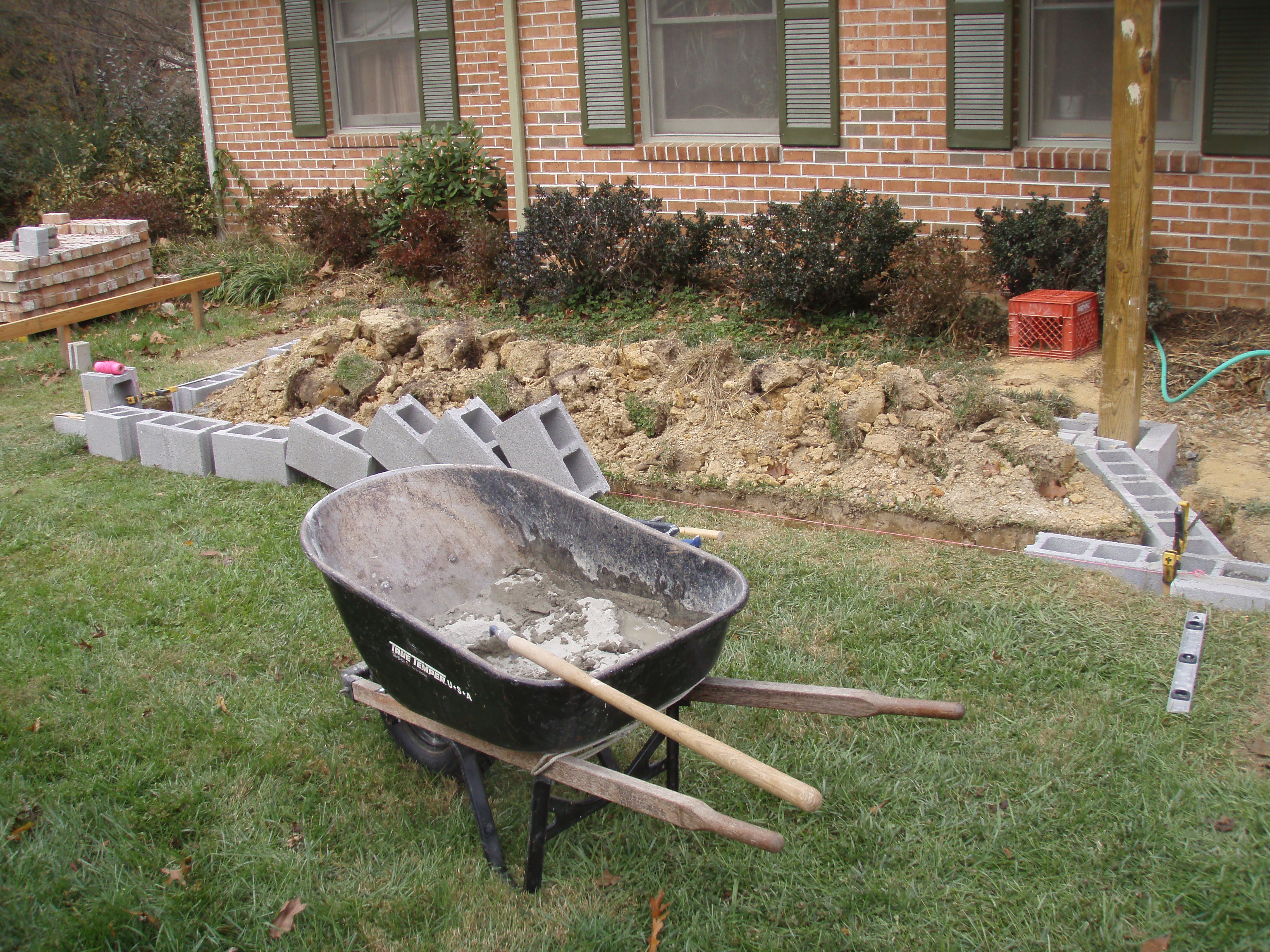 front gable porch with brick raised garden