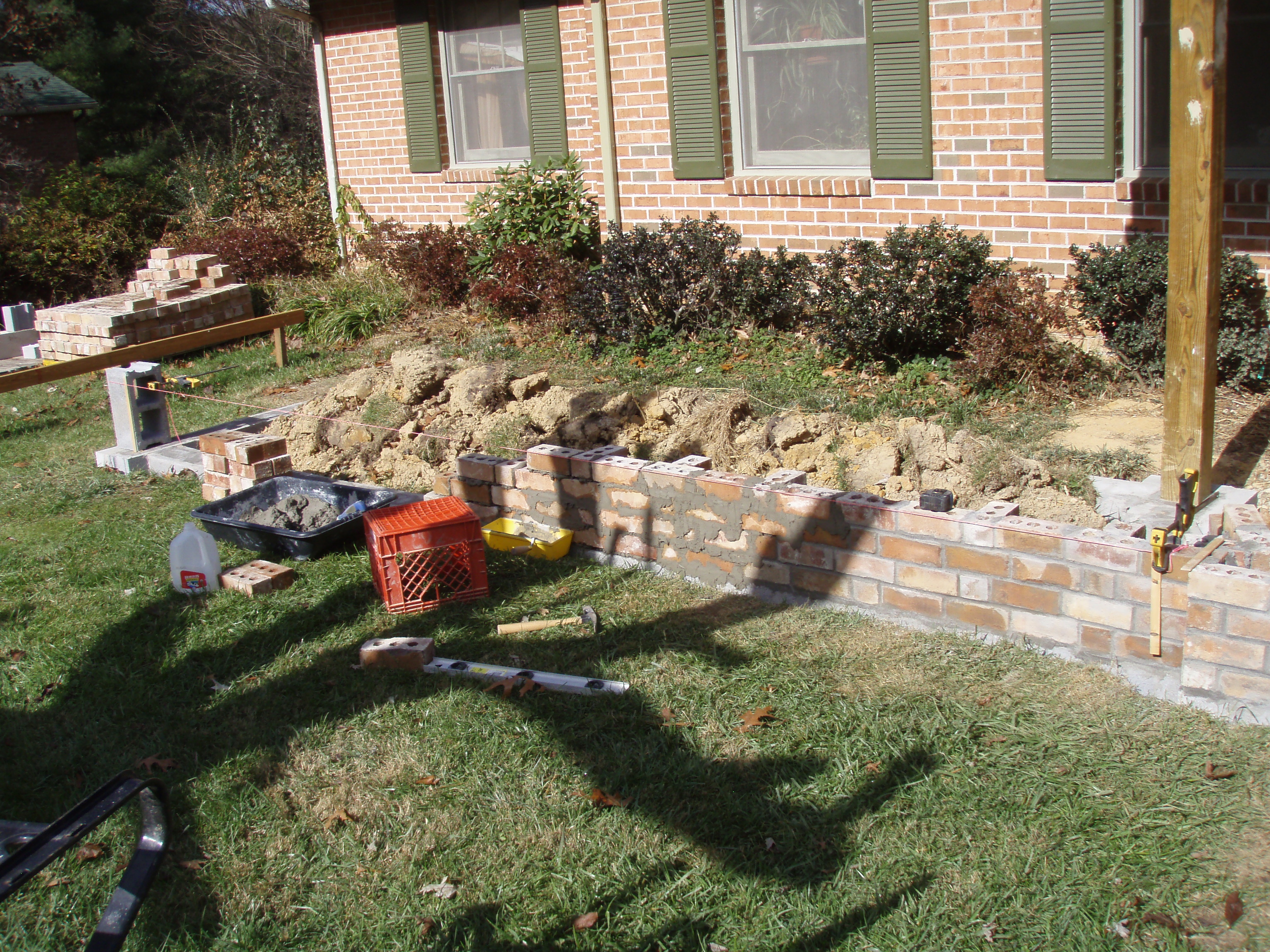 front gable porch with brick raised garden