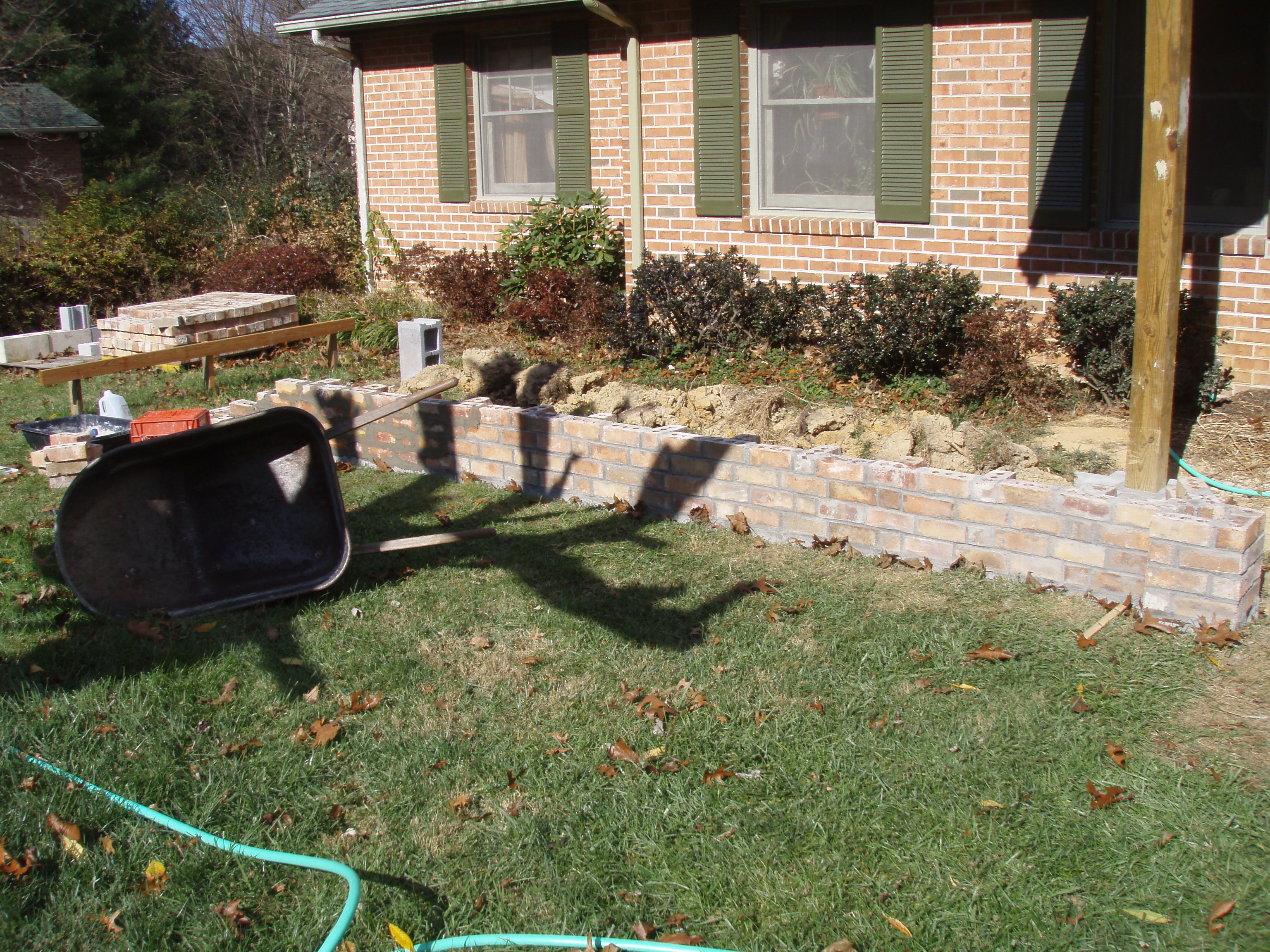 front gable porch with brick raised garden