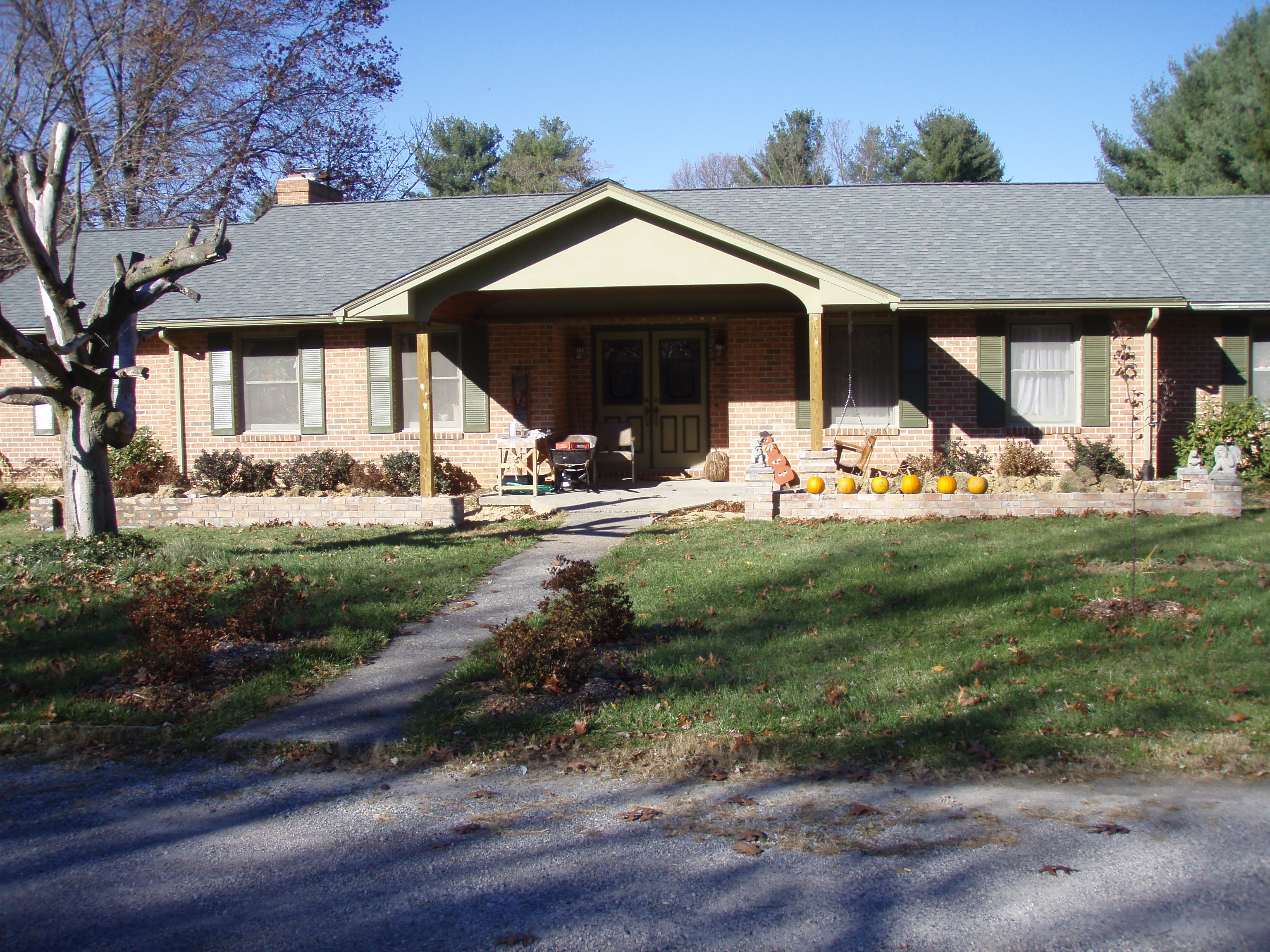 front gable porch with brick raised garden