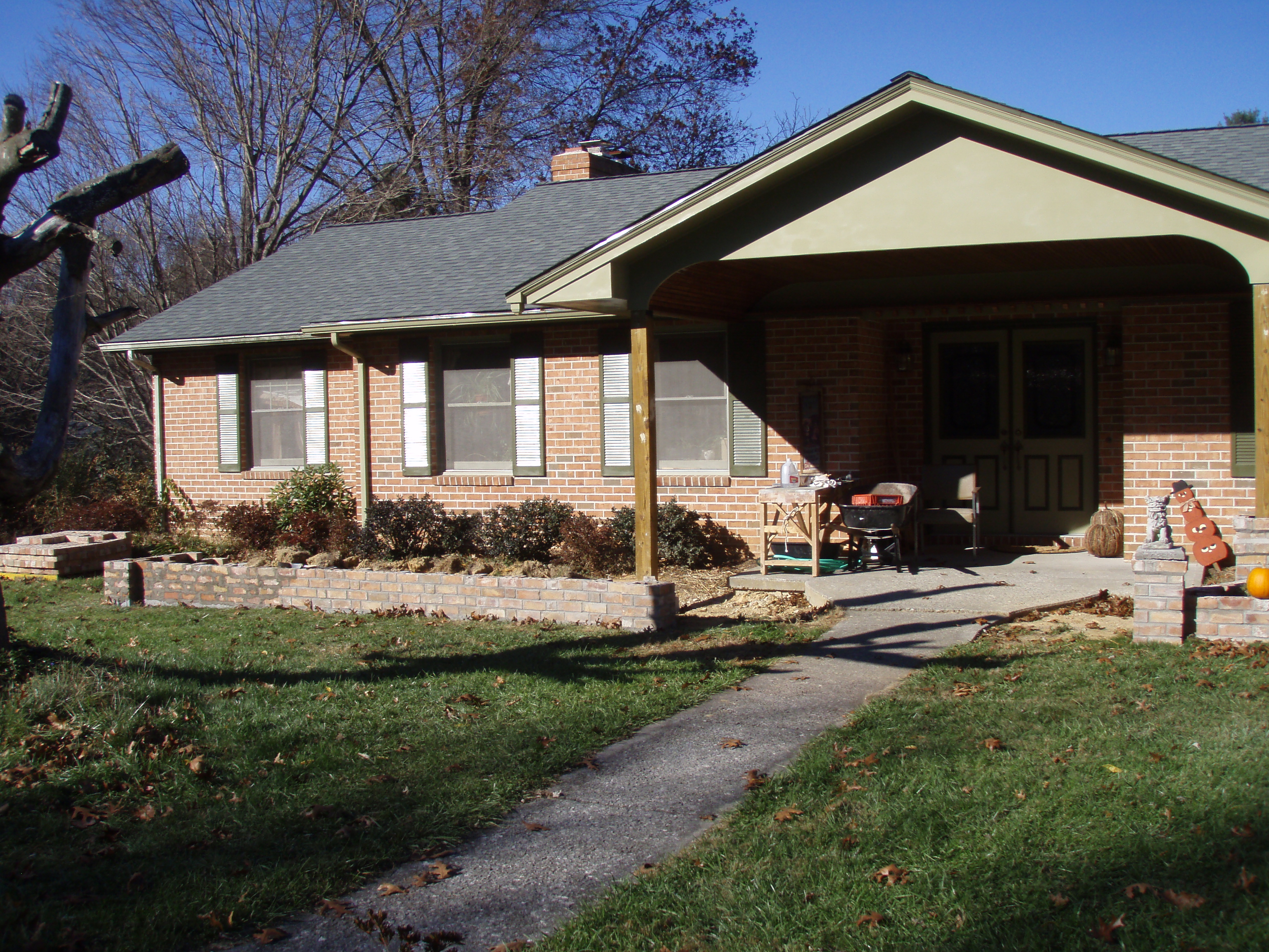 front gable porch with brick raised garden