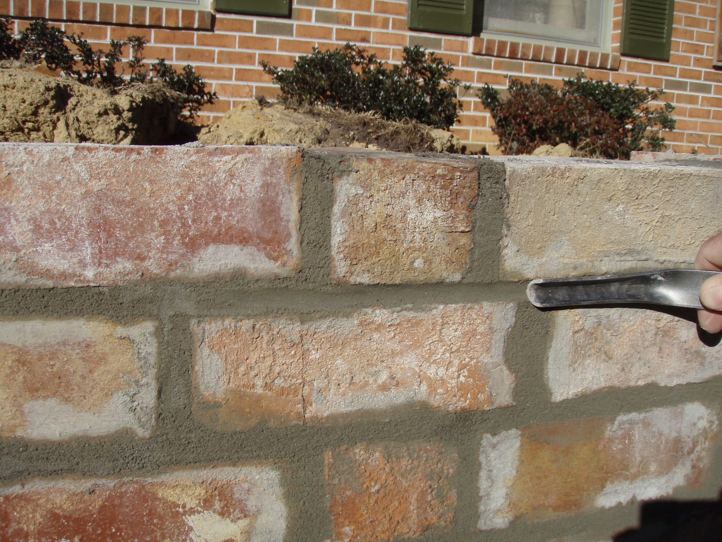 front gable porch with brick raised garden