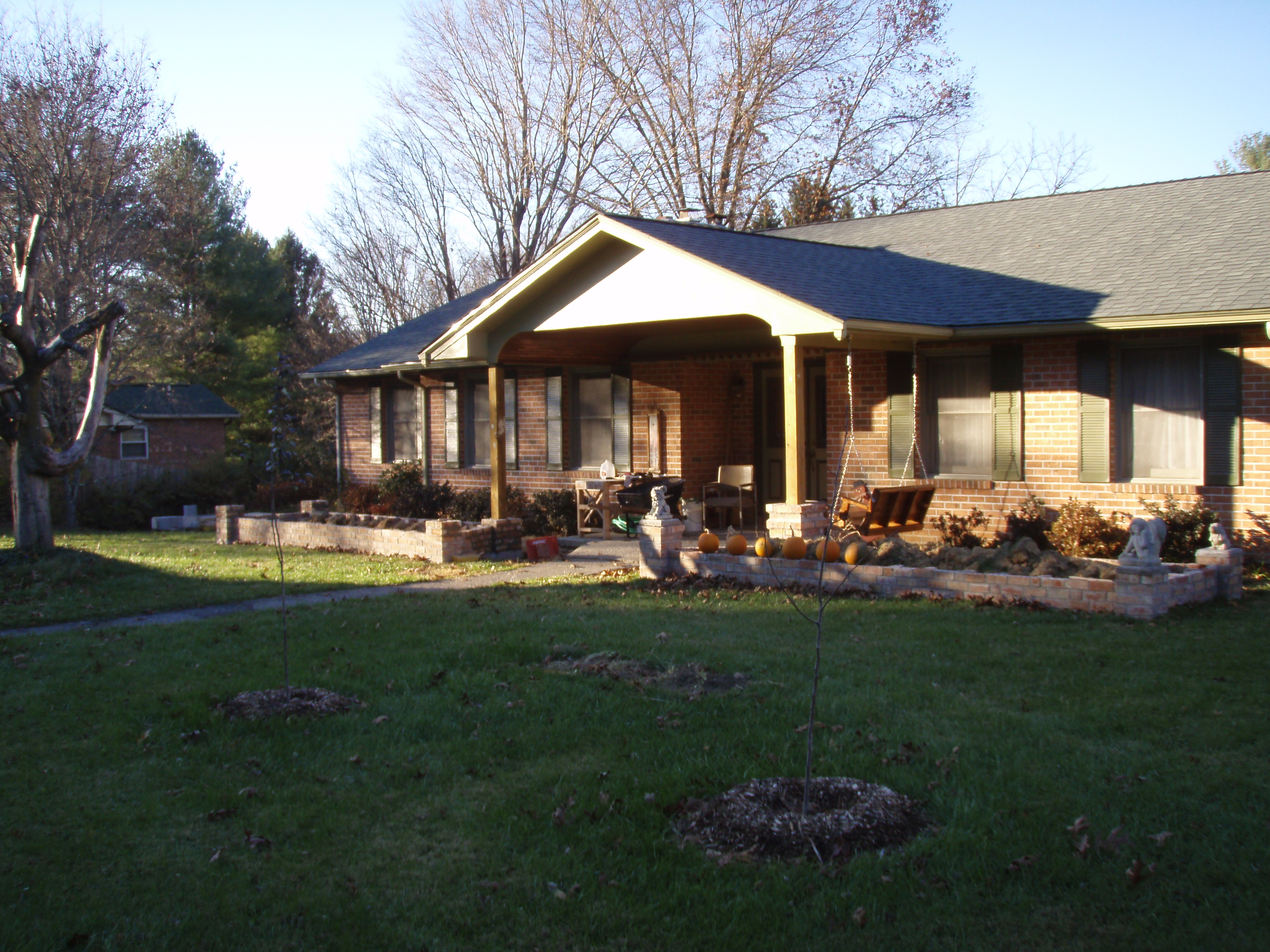 front gable porch with brick raised garden