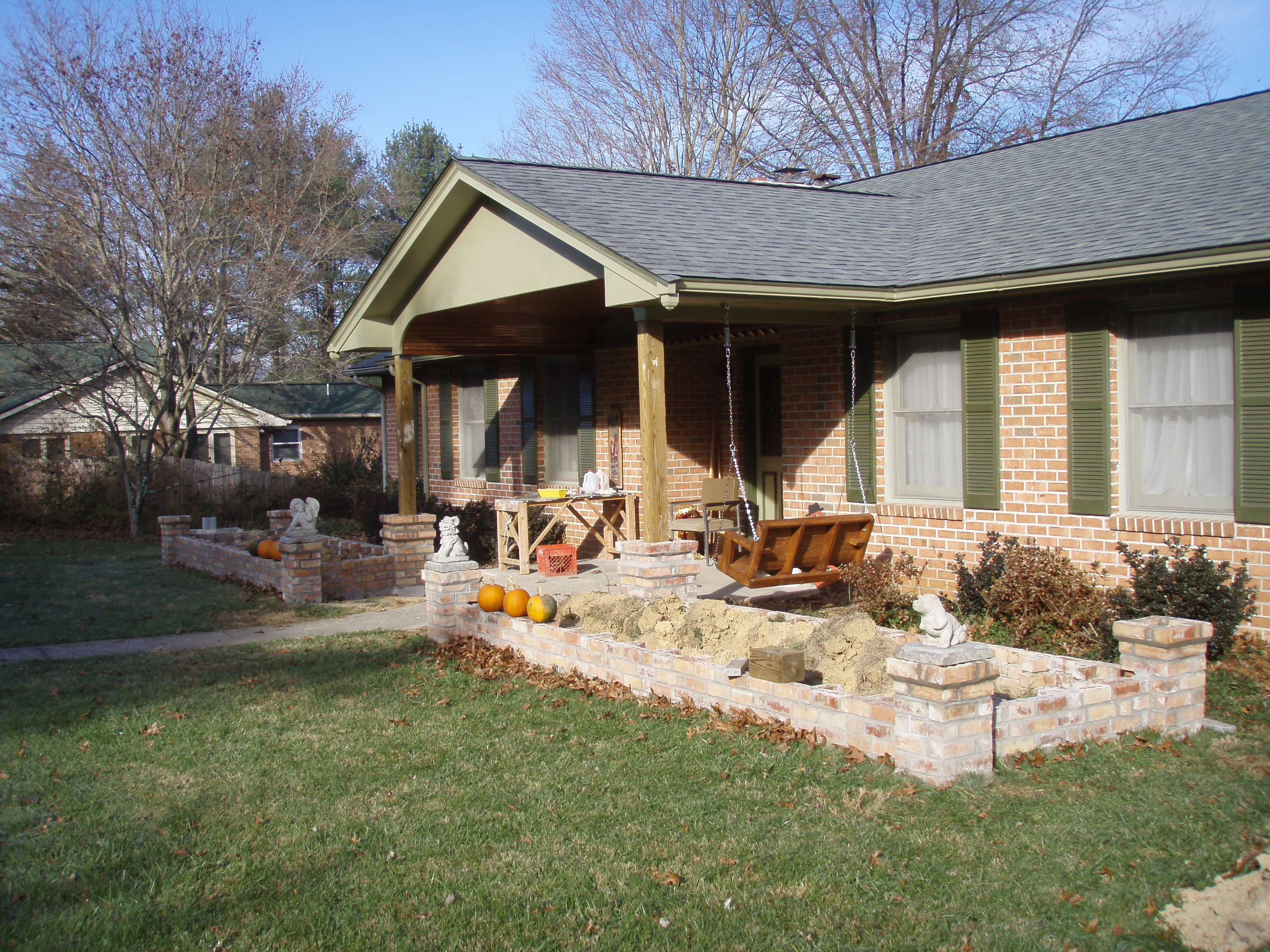 front gable porch with brick raised garden