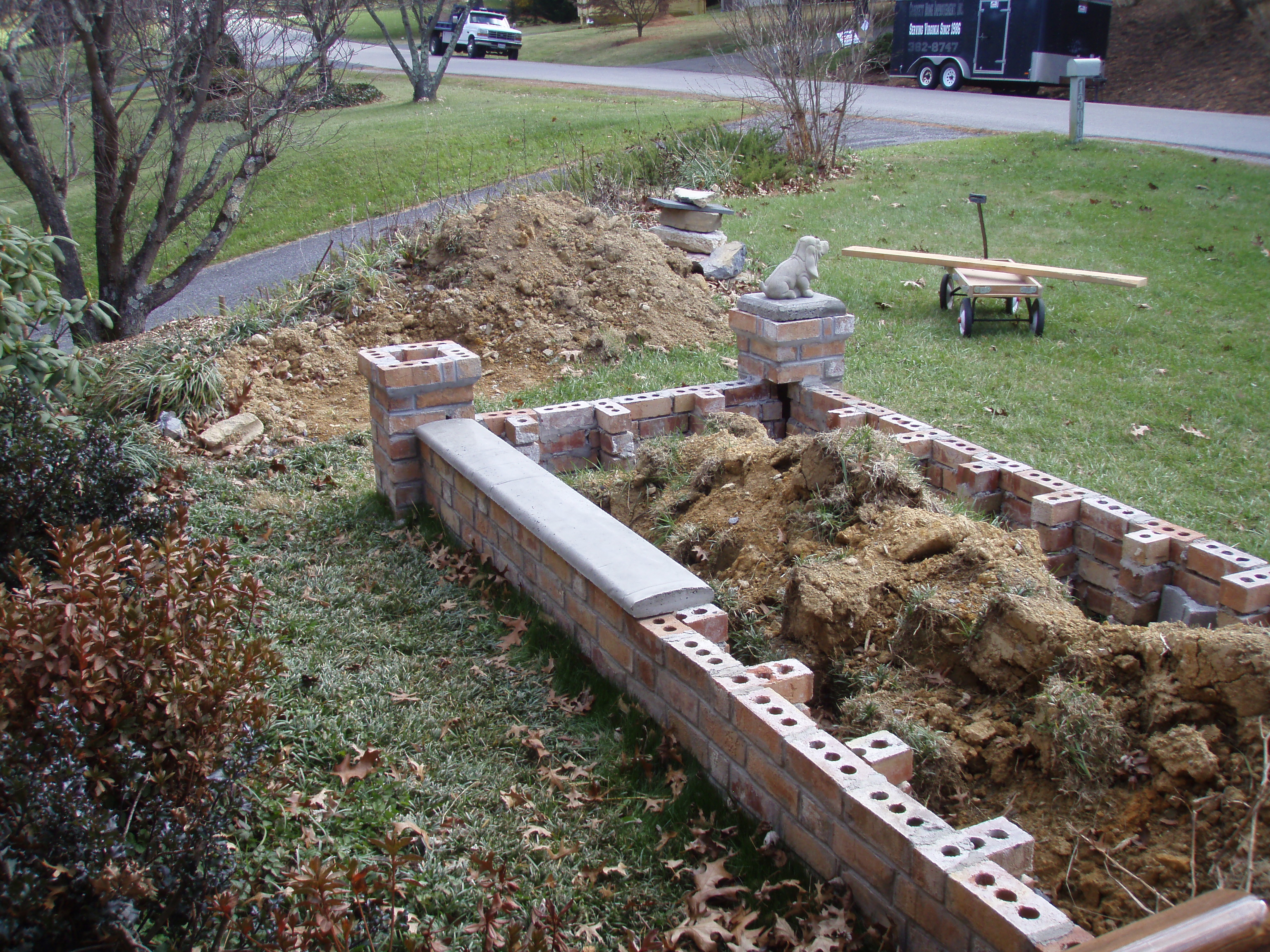 front gable porch with brick raised garden