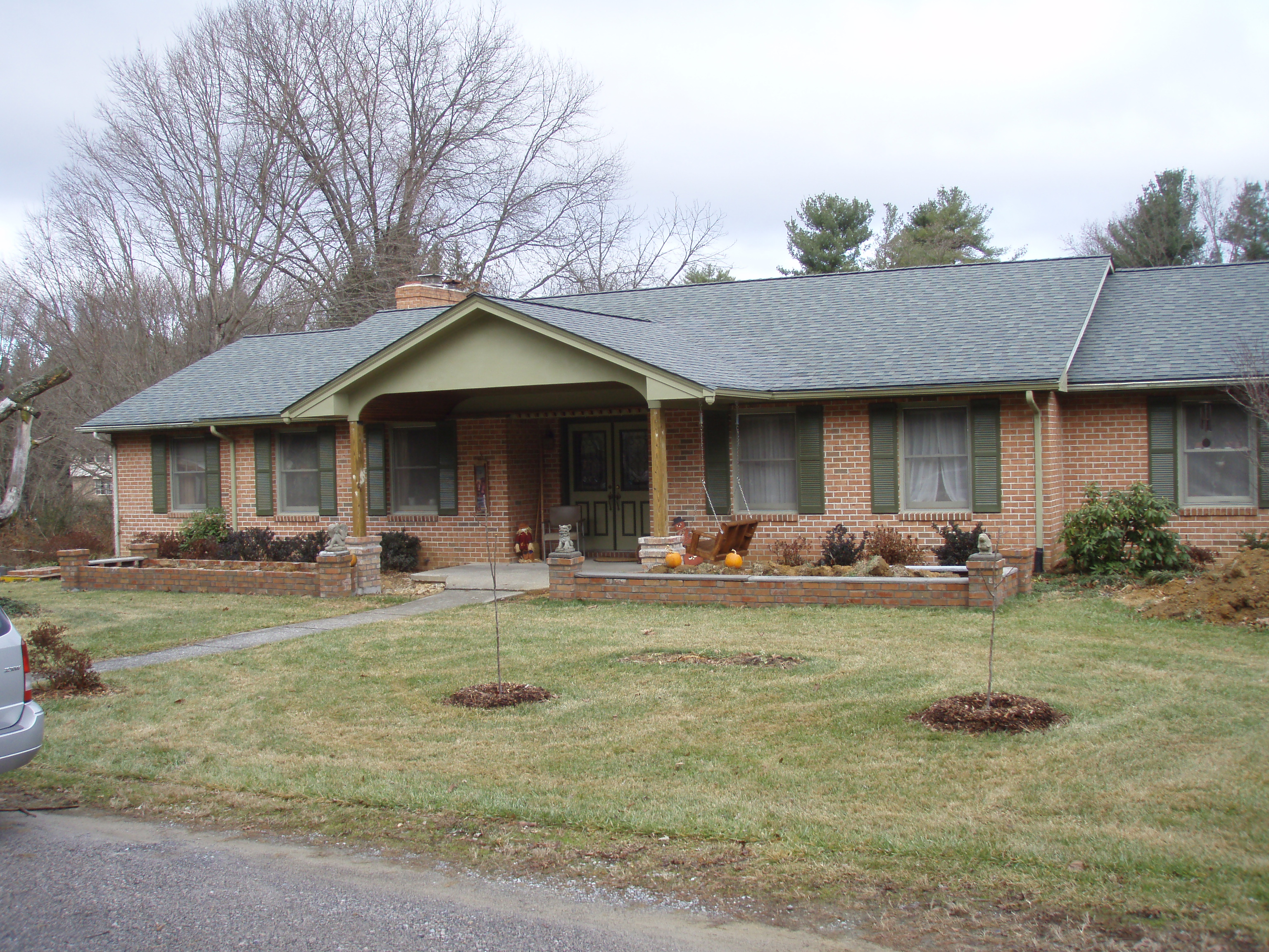 front gable porch with brick raised garden