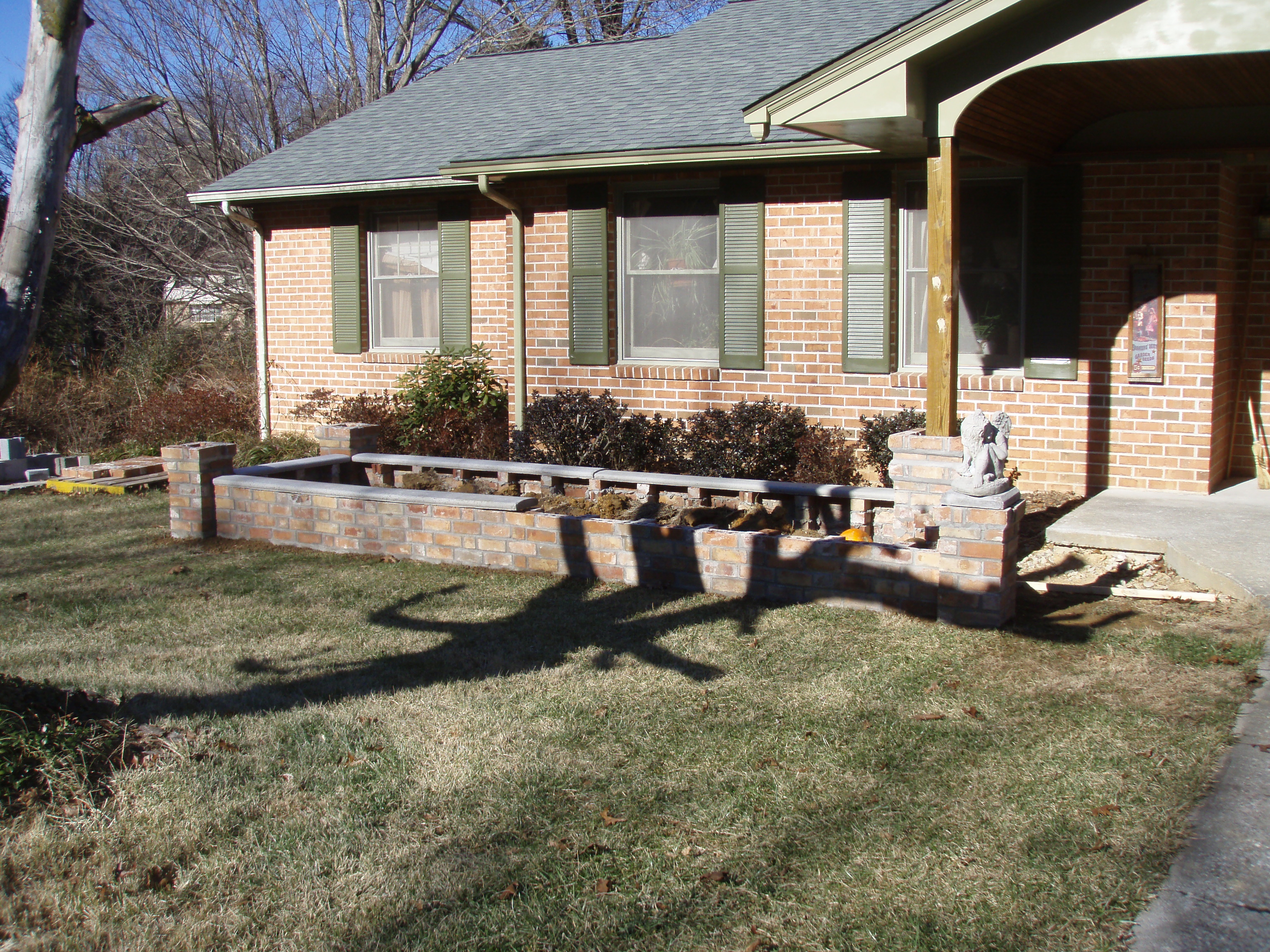 front gable porch with brick raised garden