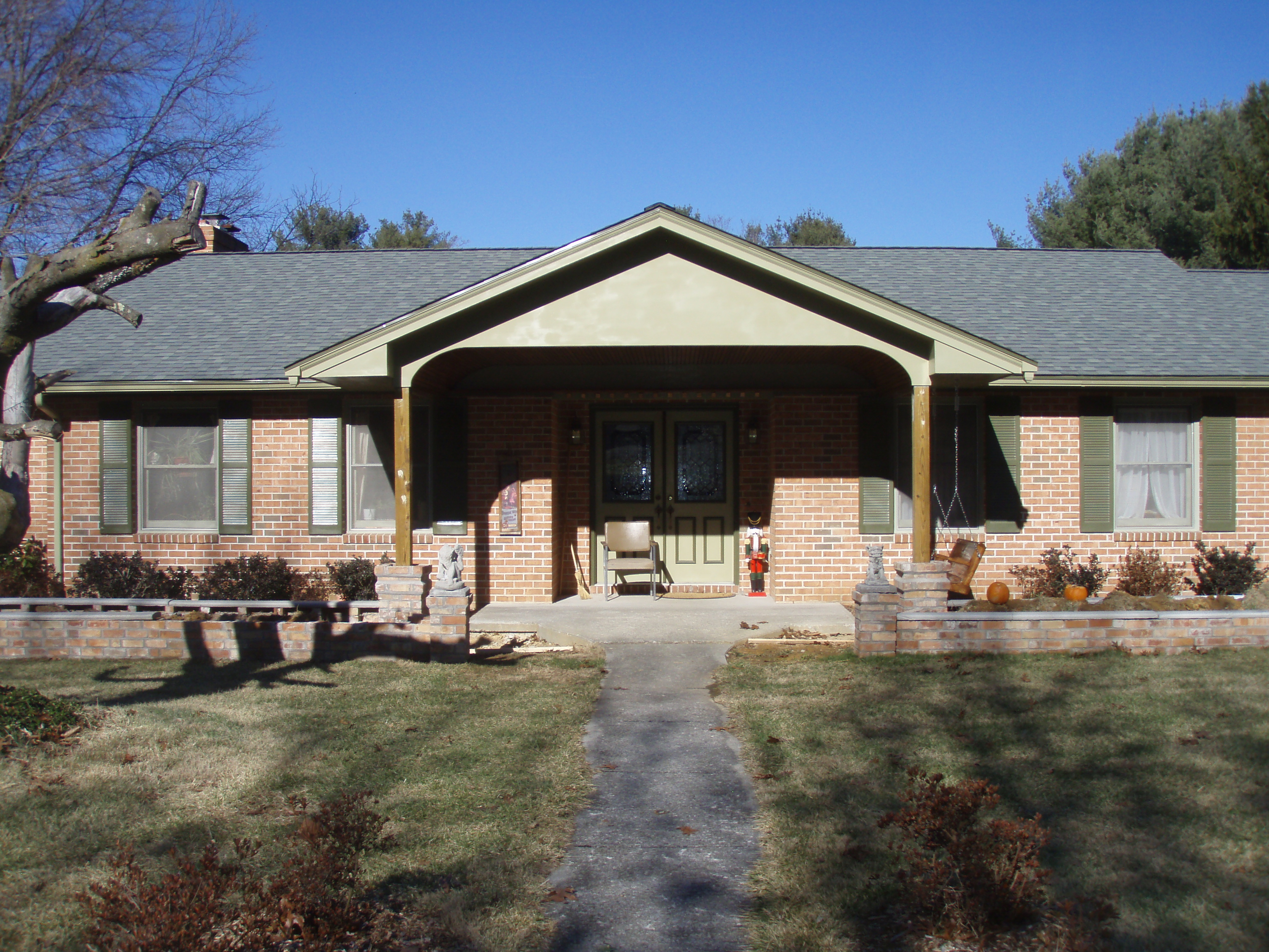 front gable porch with brick raised garden