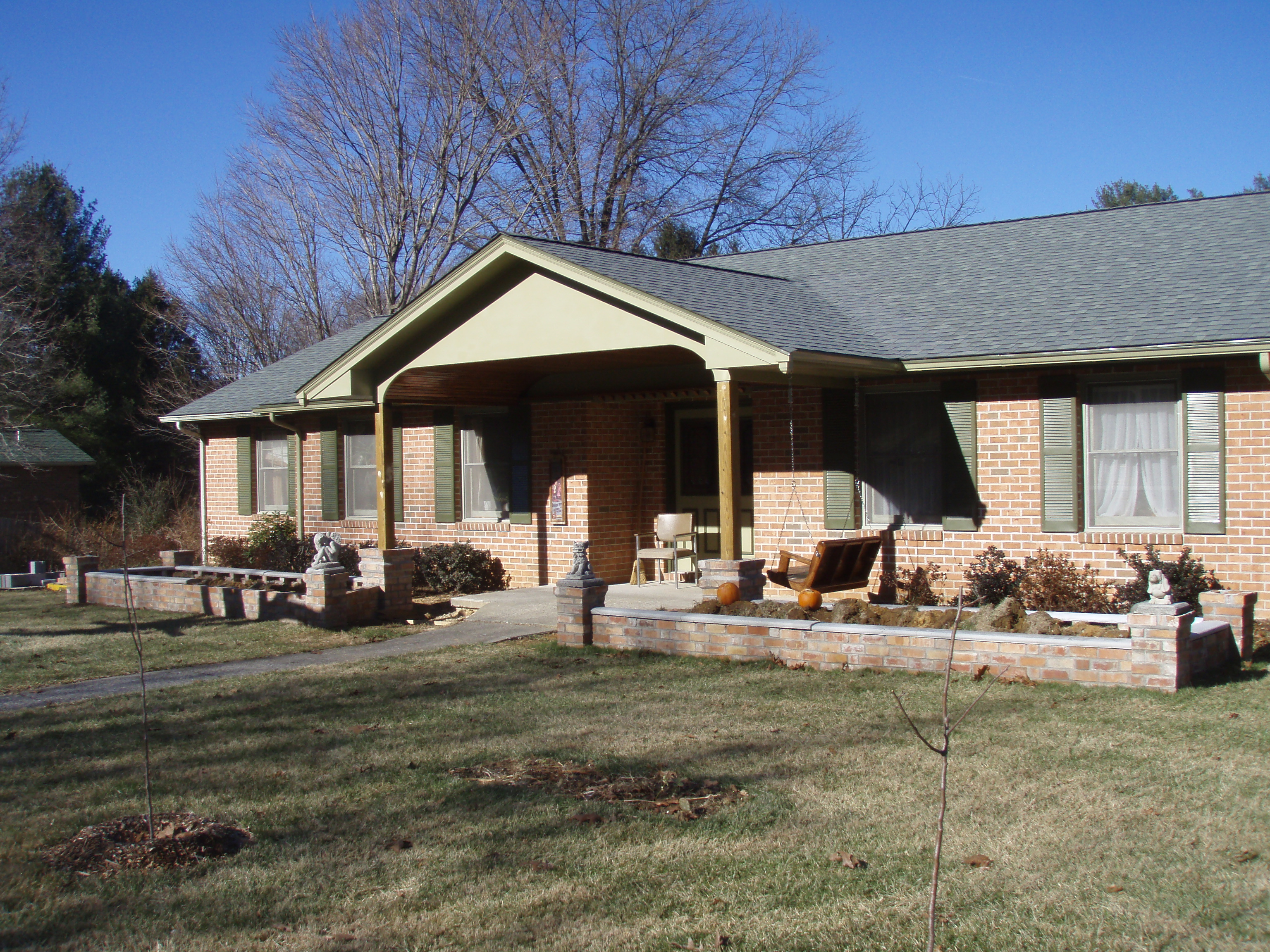 front gable porch with brick raised garden