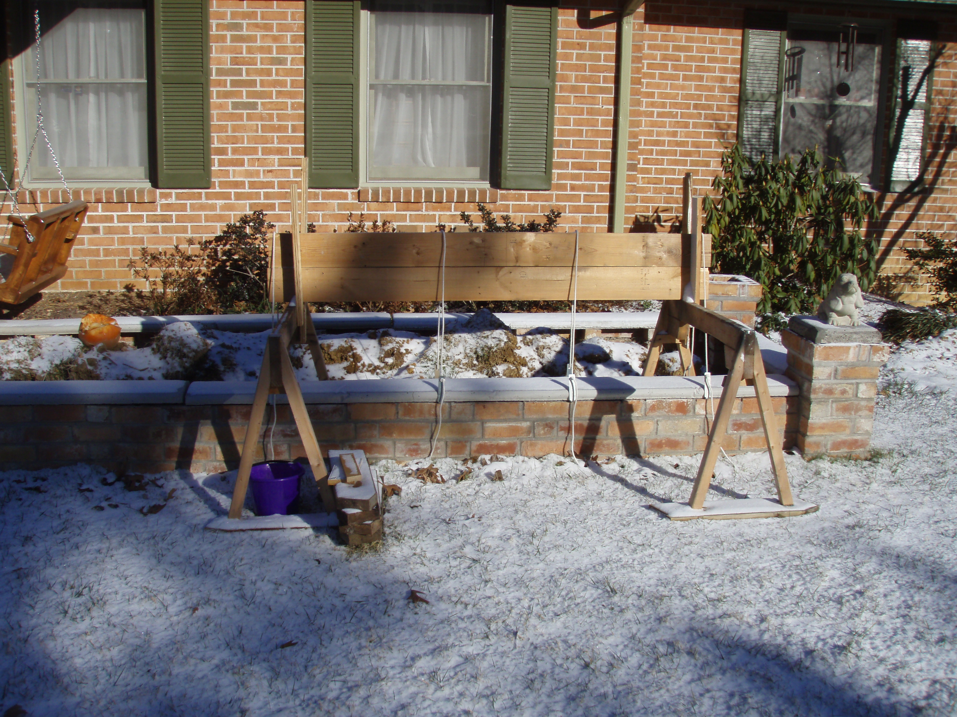 front gable porch with brick raised garden