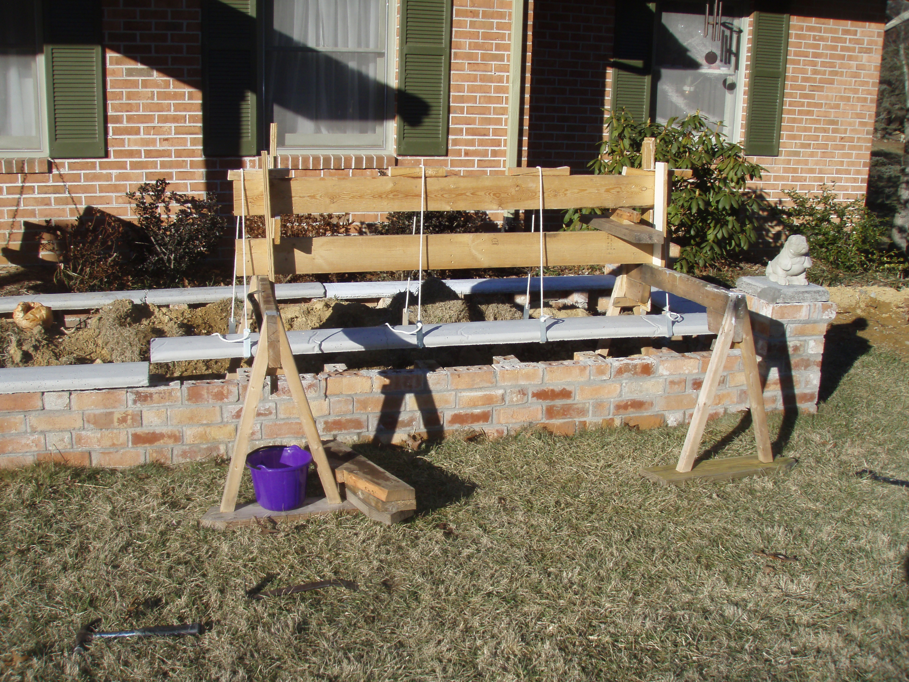 front gable porch with brick raised garden