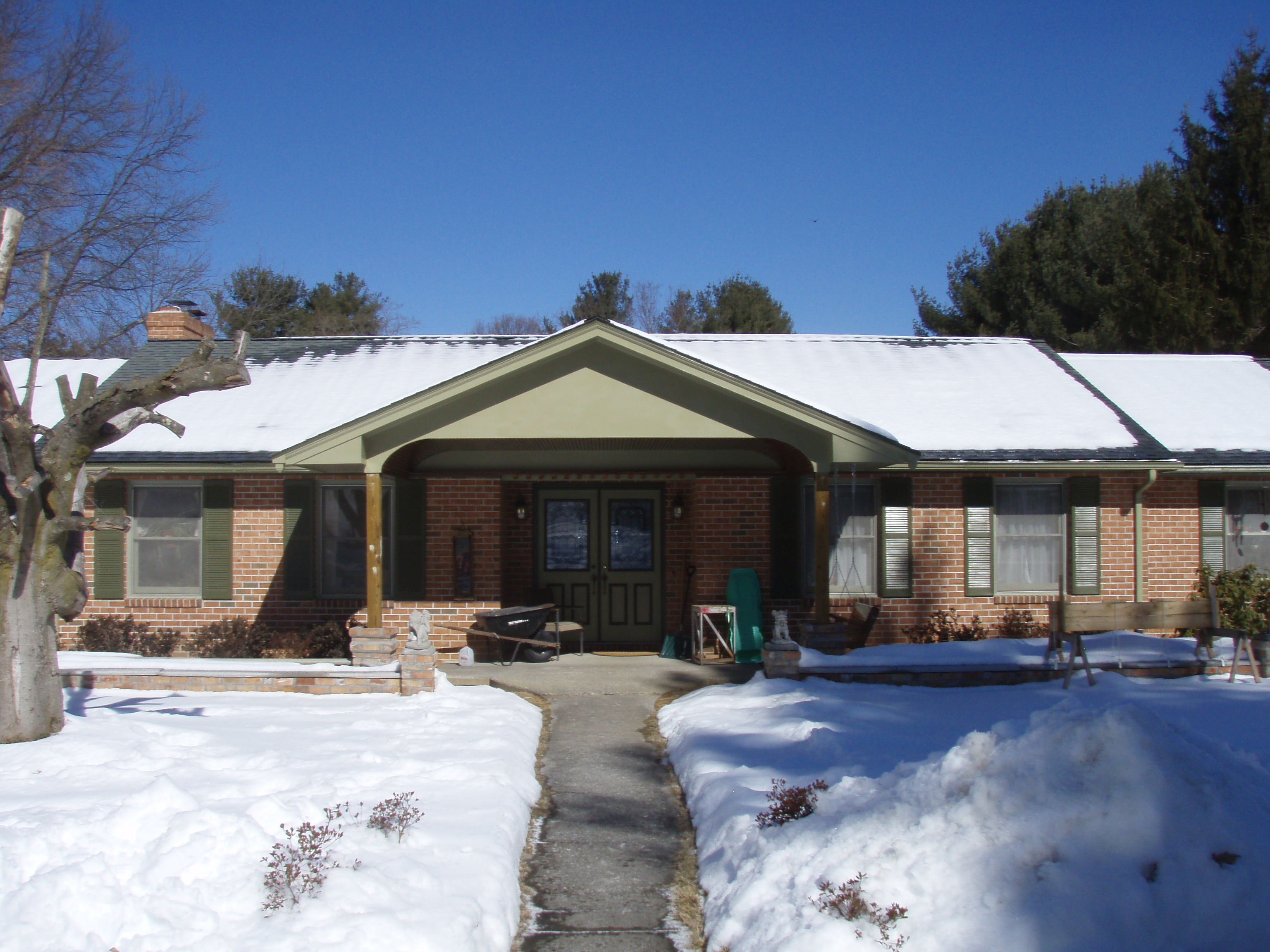 front gable porch with brick raised garden