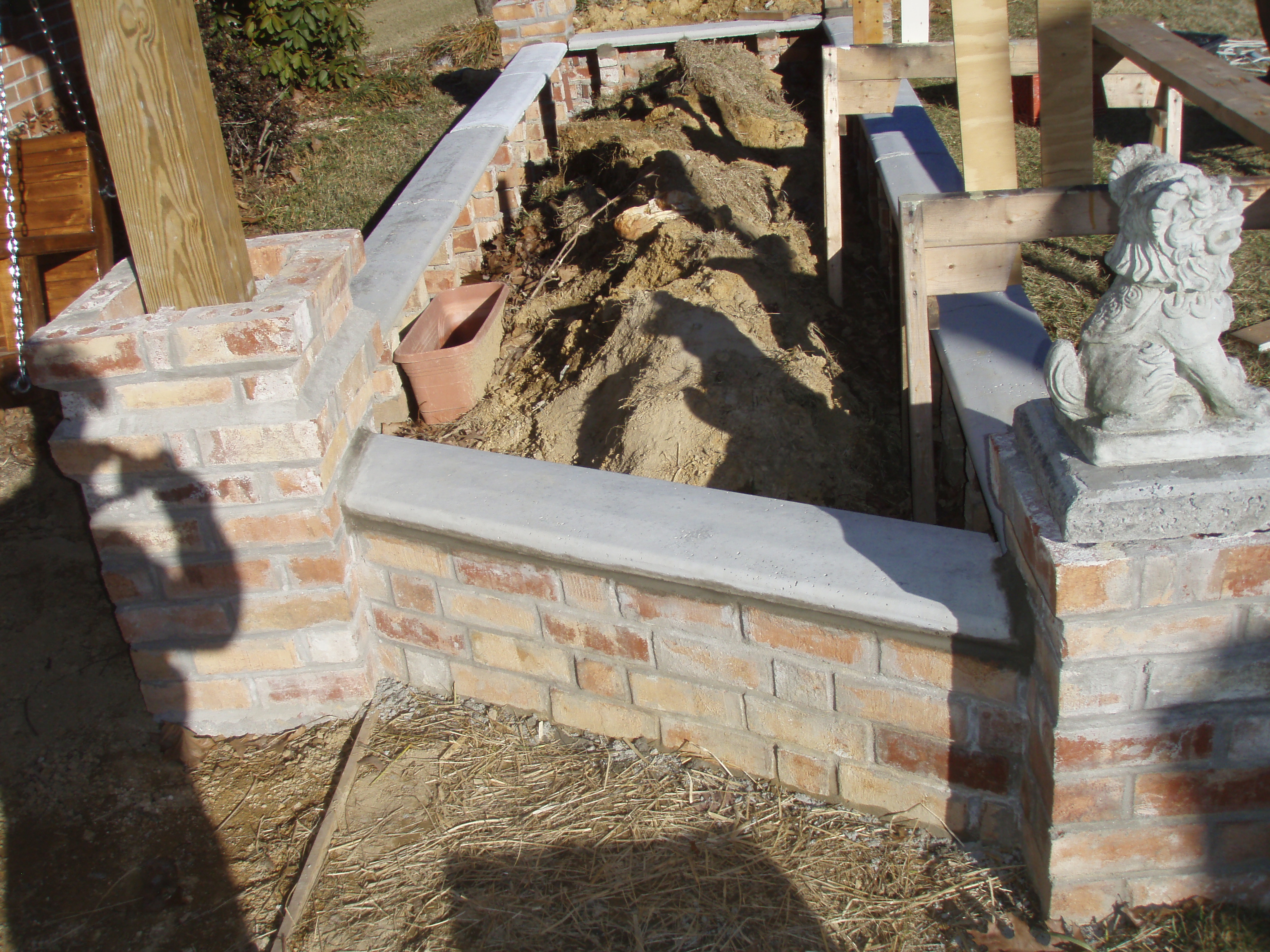 front gable porch with brick raised garden