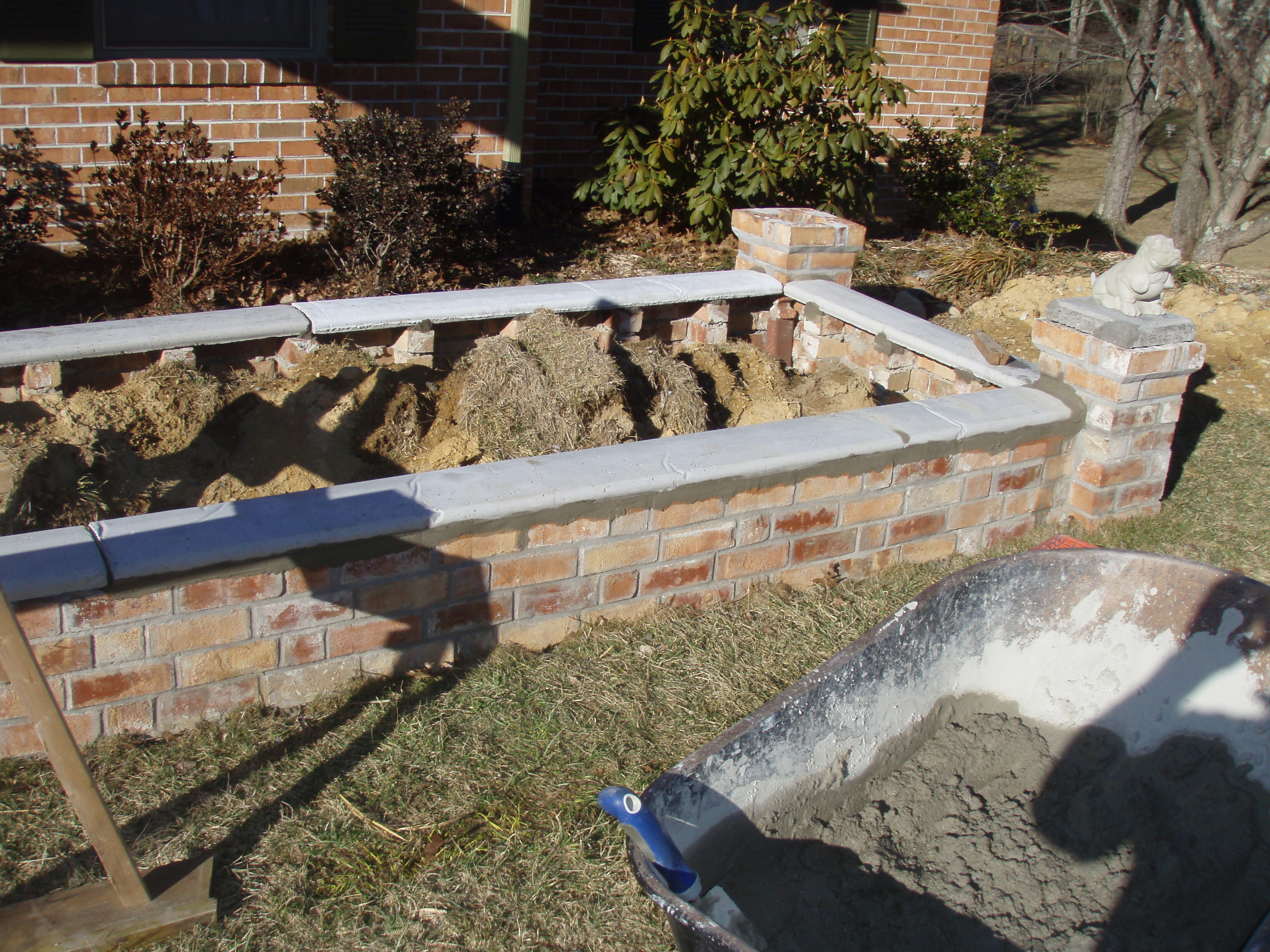 front gable porch with brick raised garden