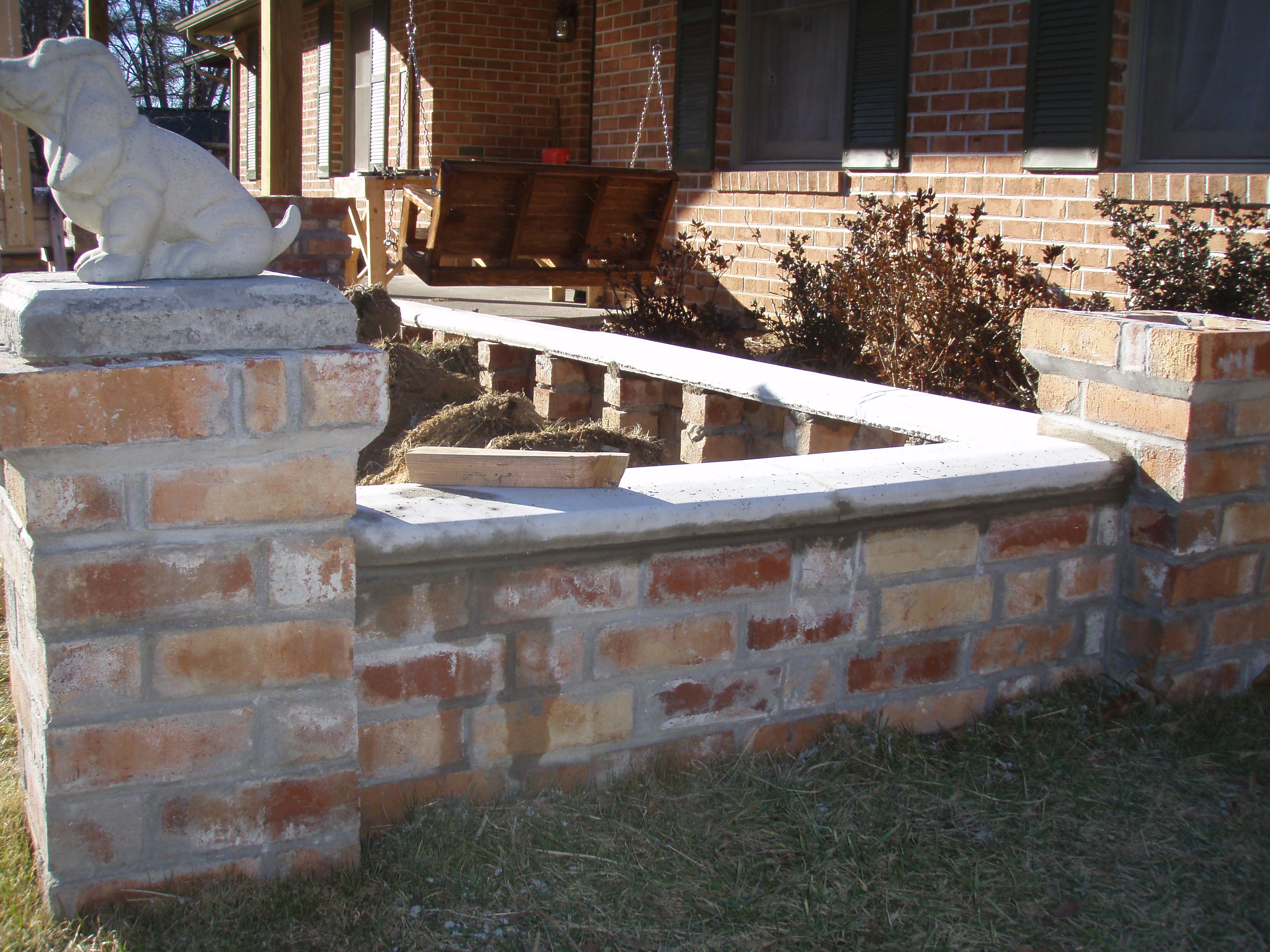 front gable porch with brick raised garden