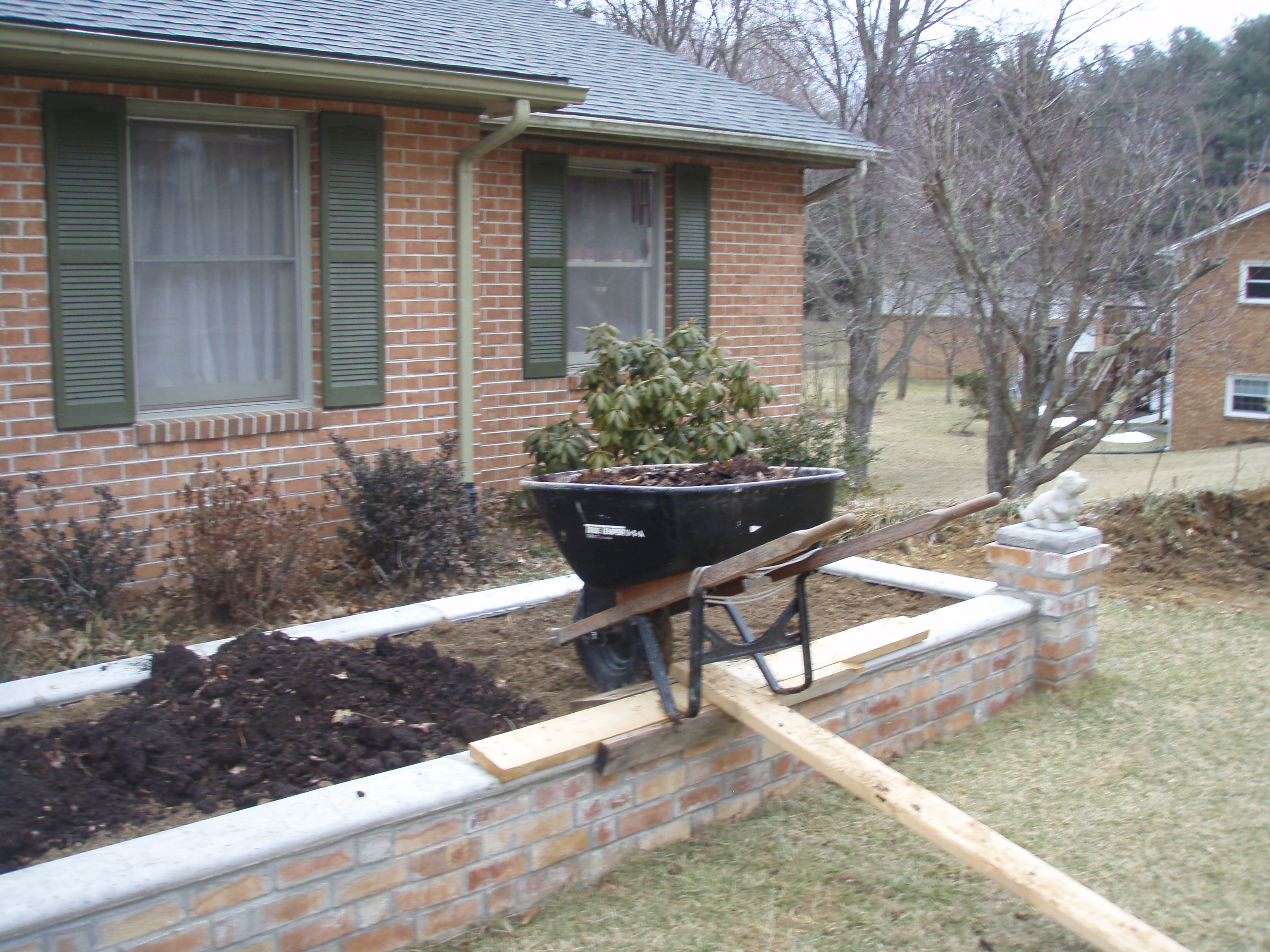 front gable porch with brick raised garden