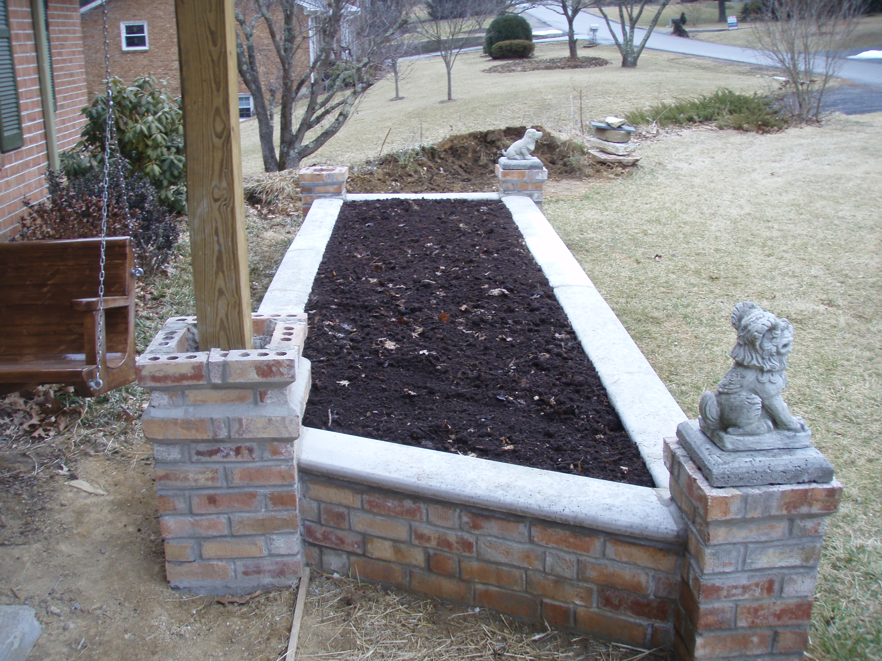 front gable porch with brick raised garden