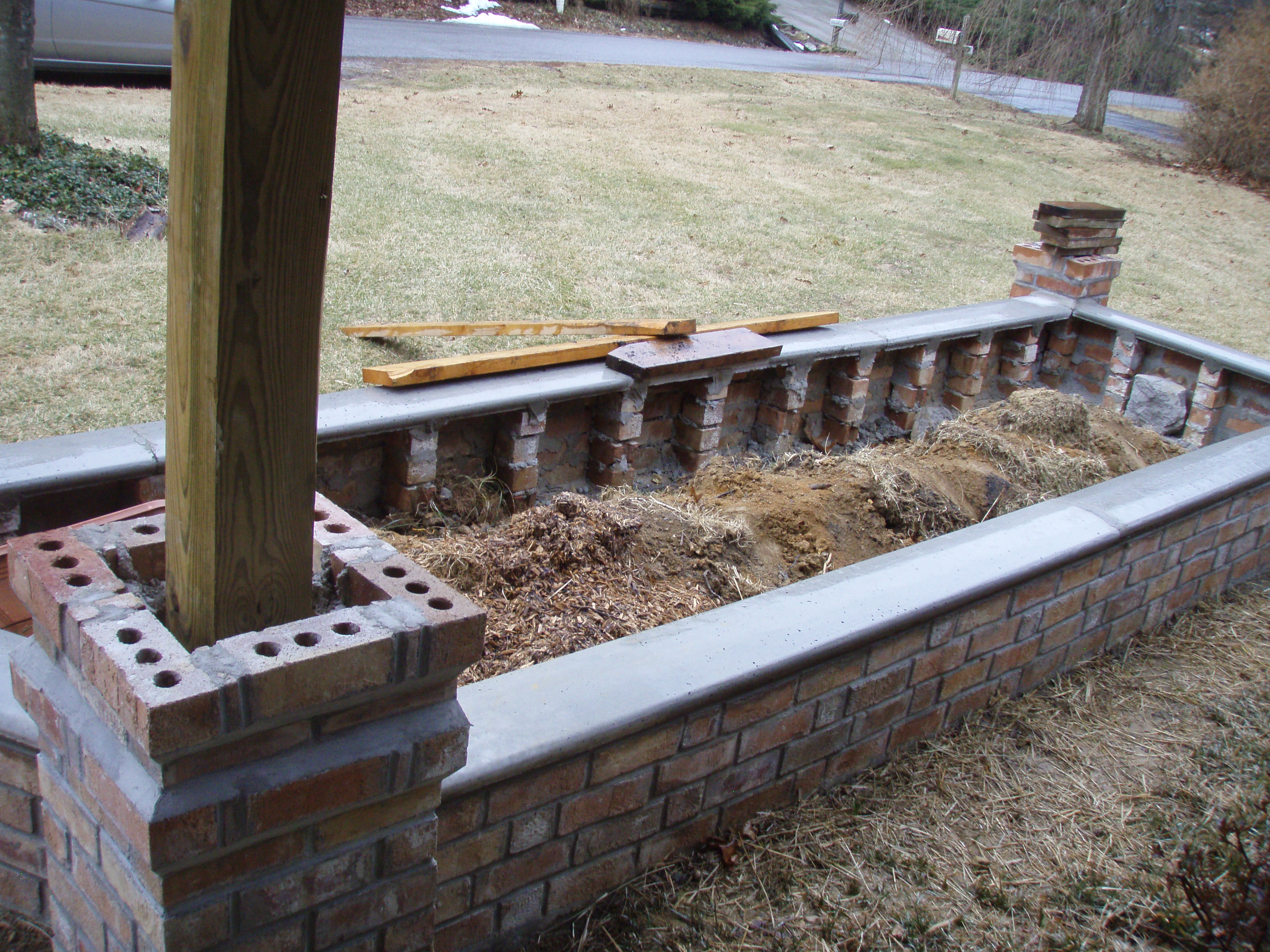 front gable porch with brick raised garden