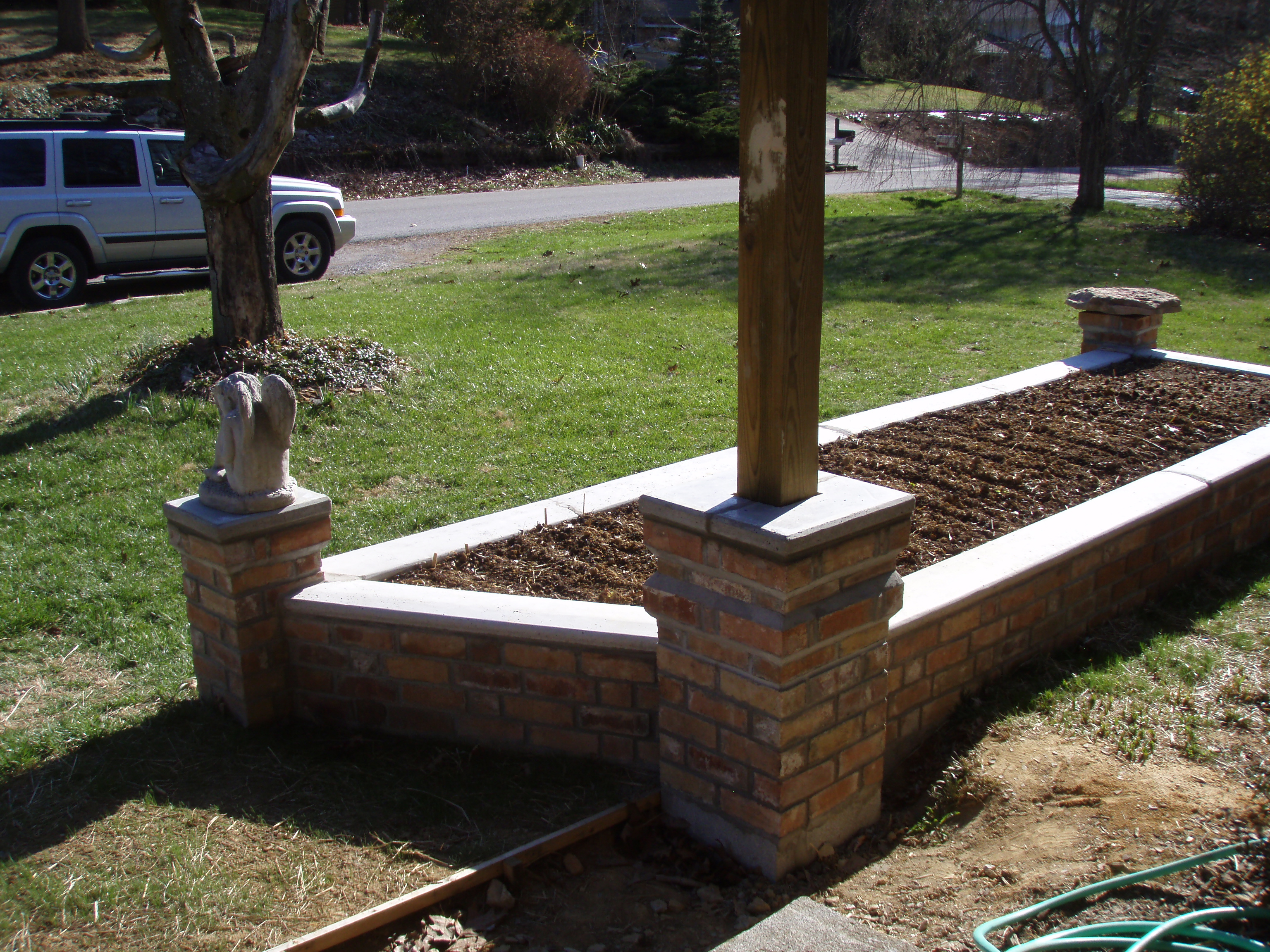 front gable porch with brick raised garden