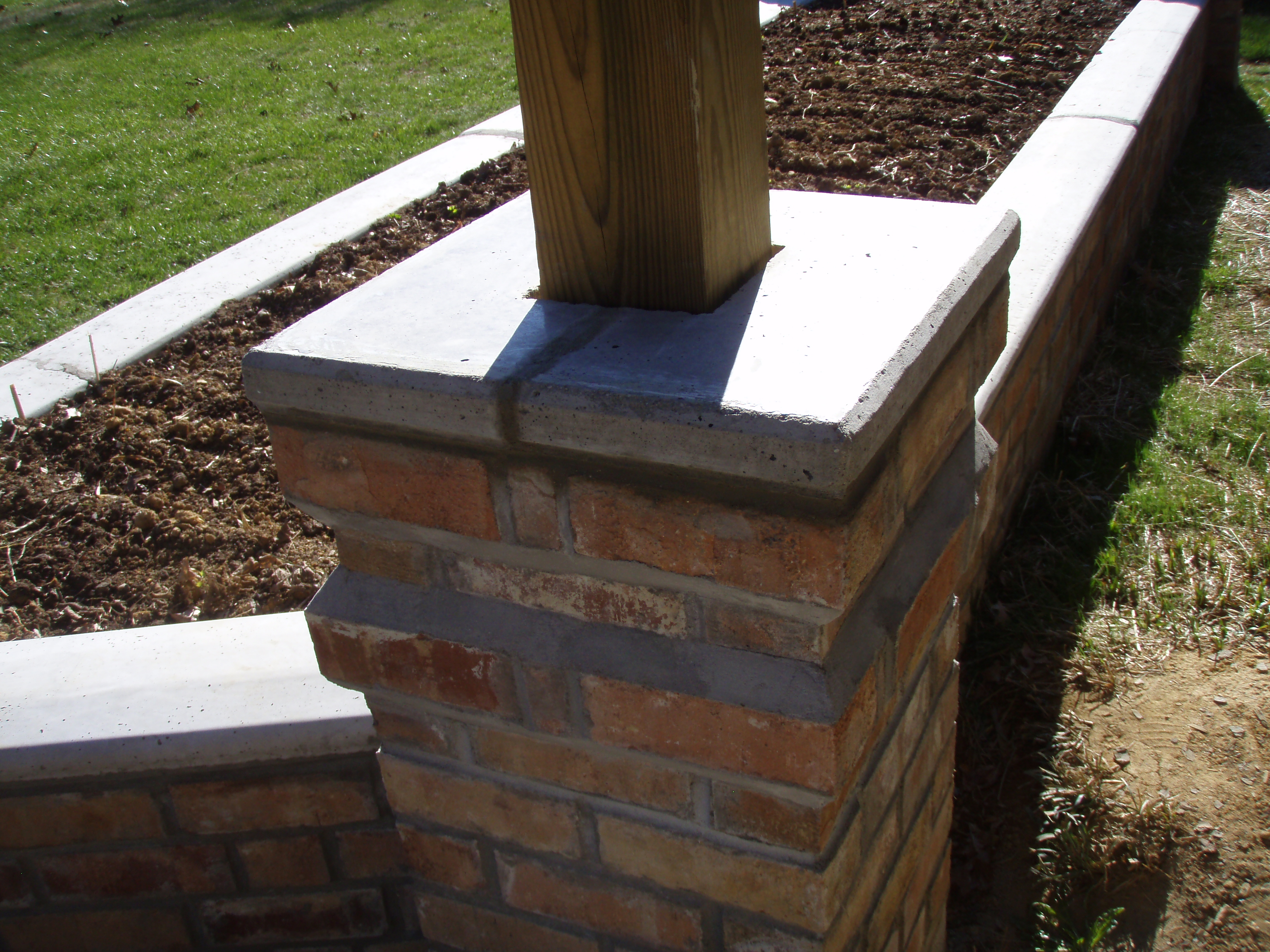 front gable porch with brick raised garden