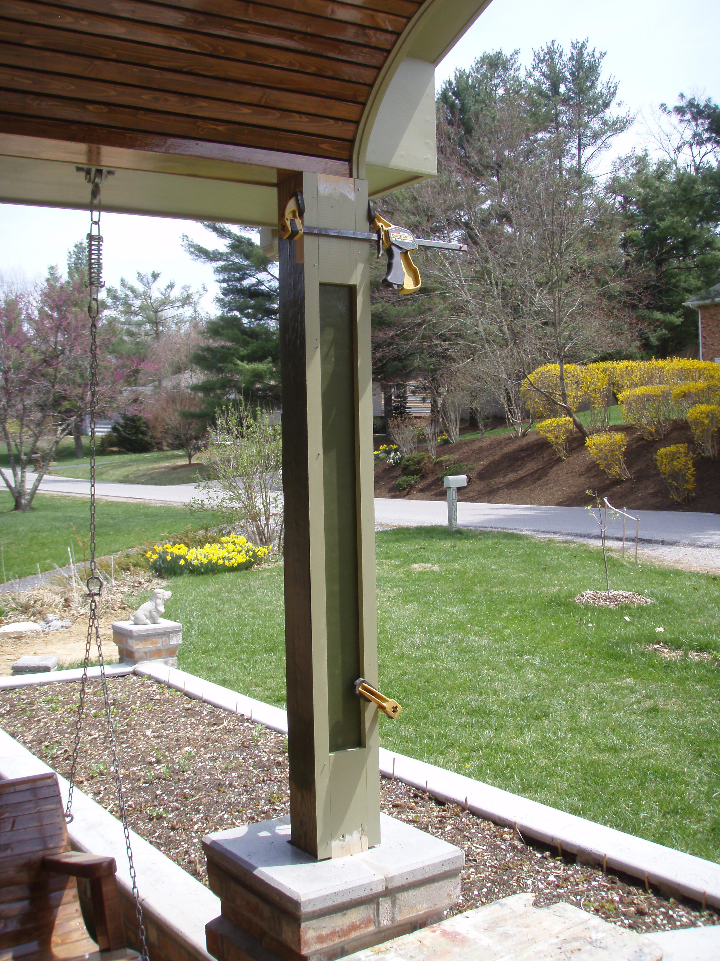 front gable porch with brick raised garden