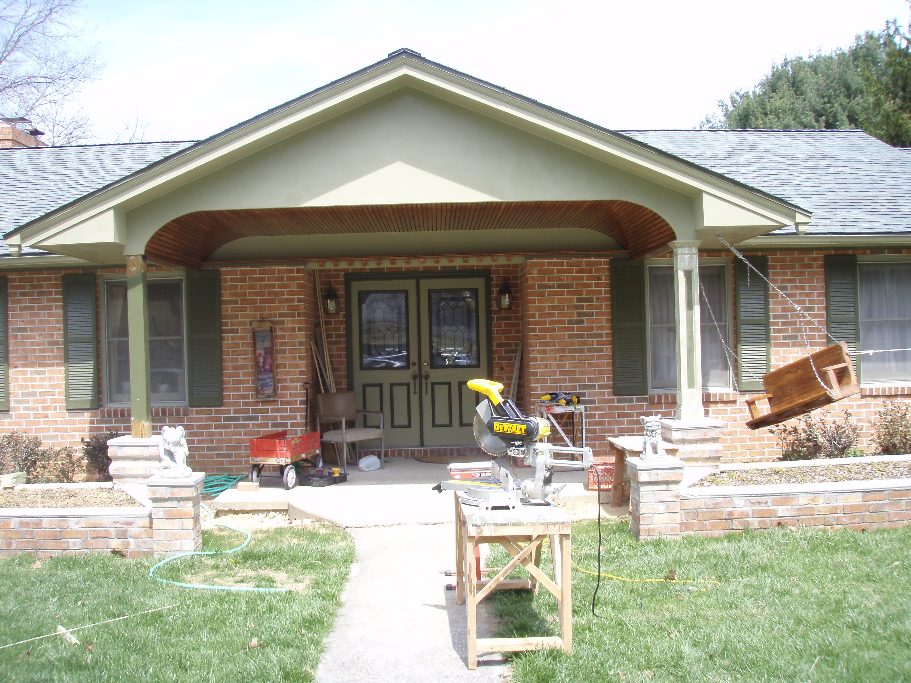 front gable porch with brick raised garden