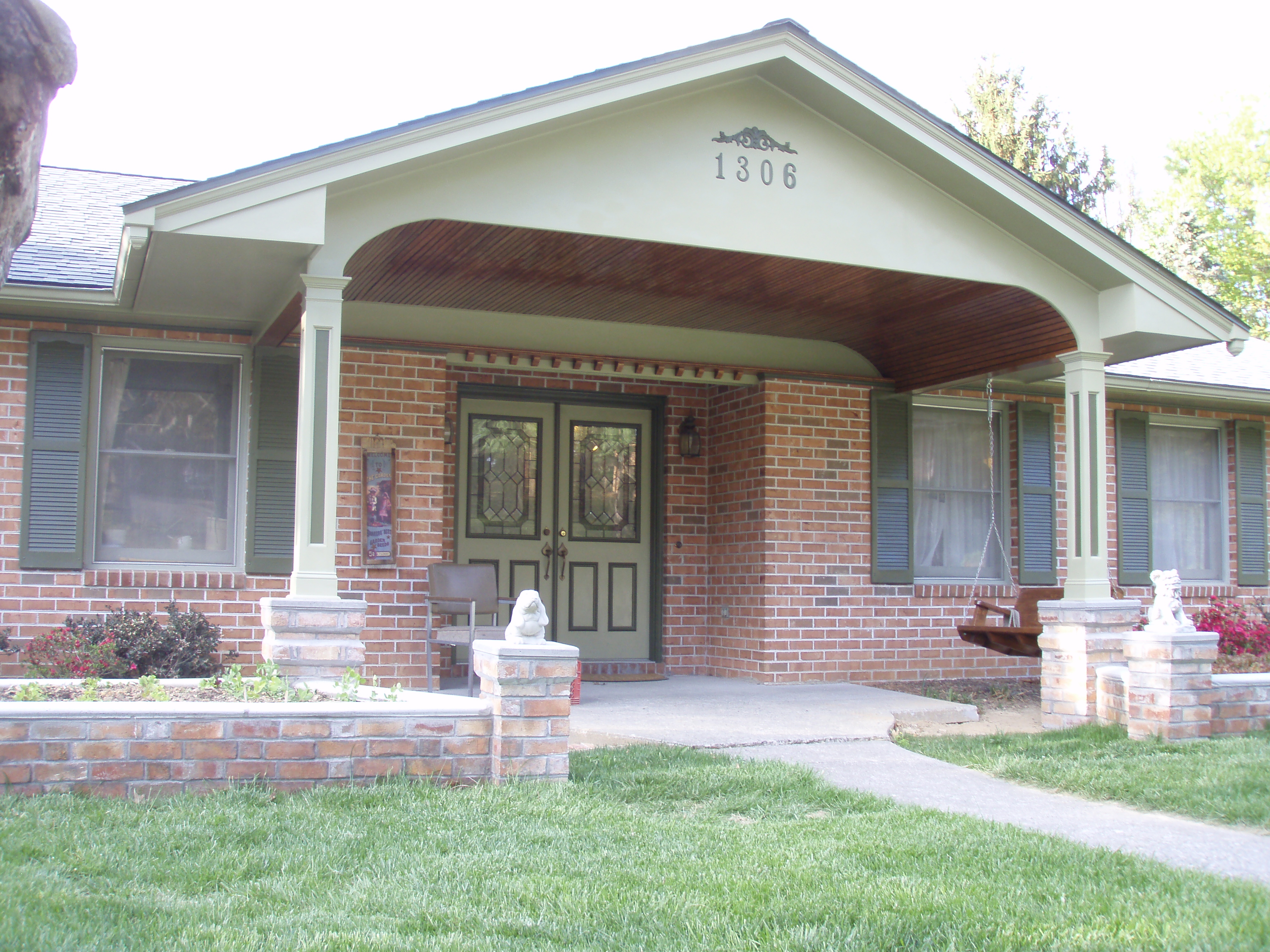 front gable porch with brick raised garden