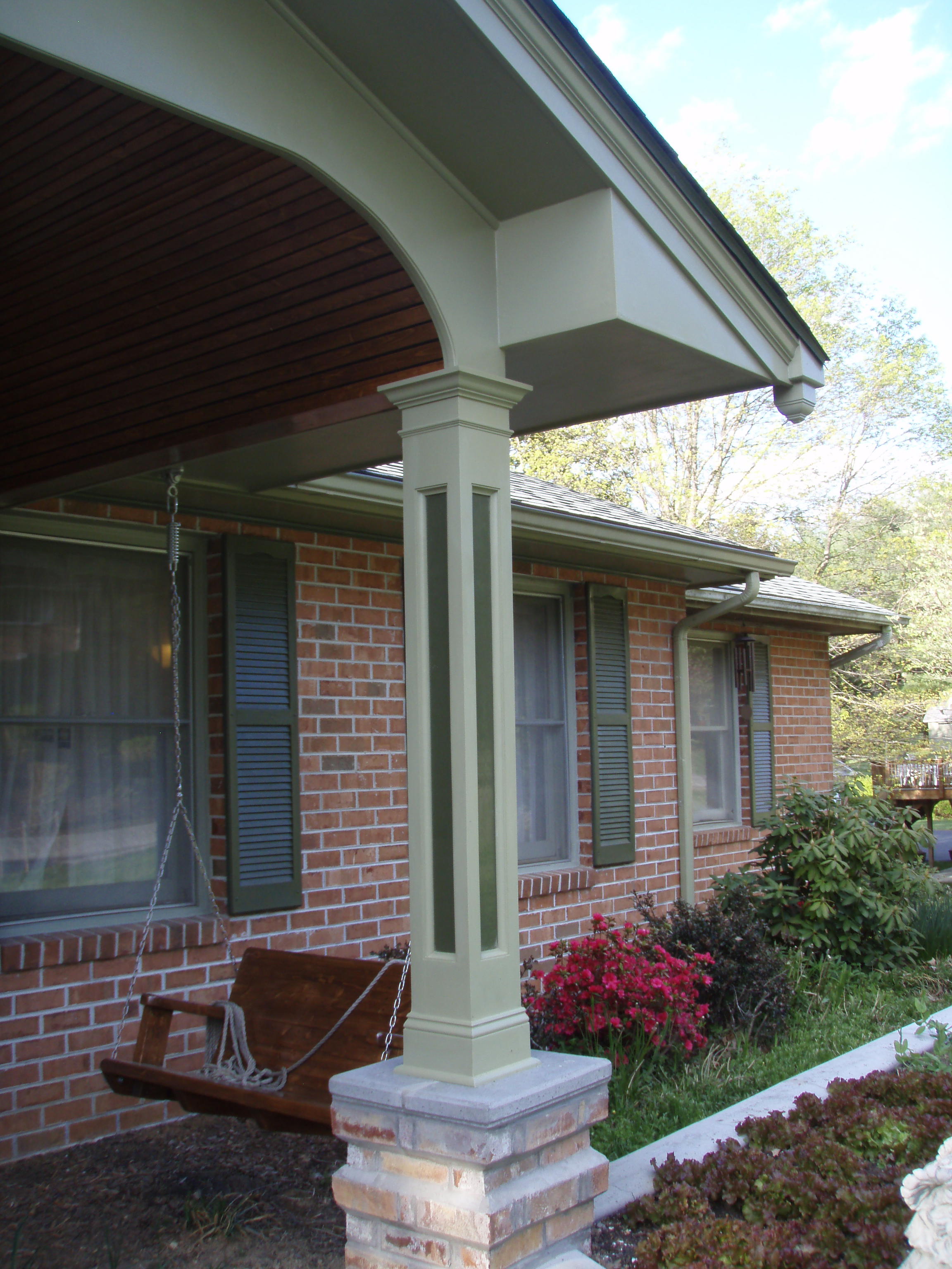 front gable porch with brick raised garden