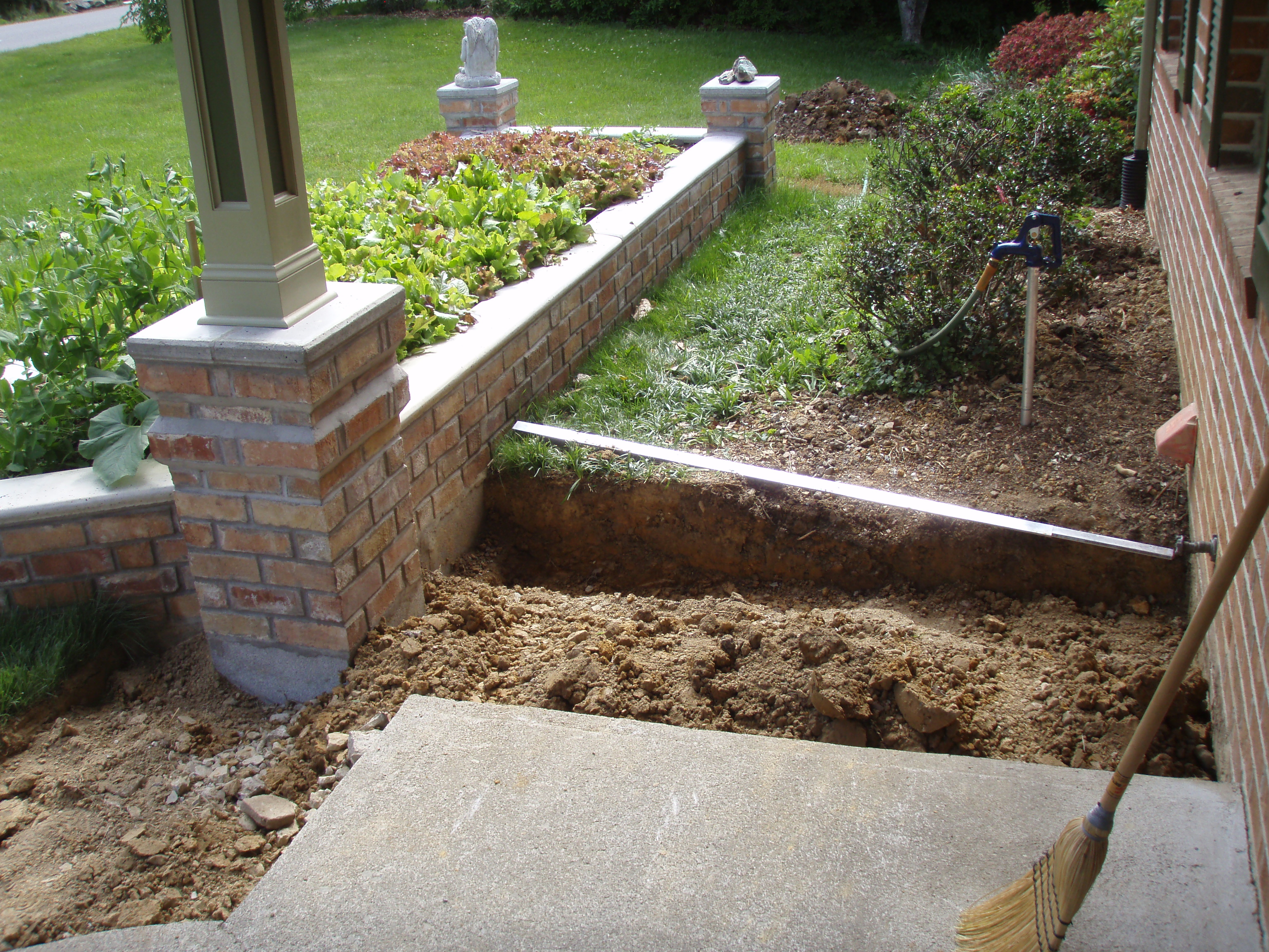 front gable porch with brick raised garden