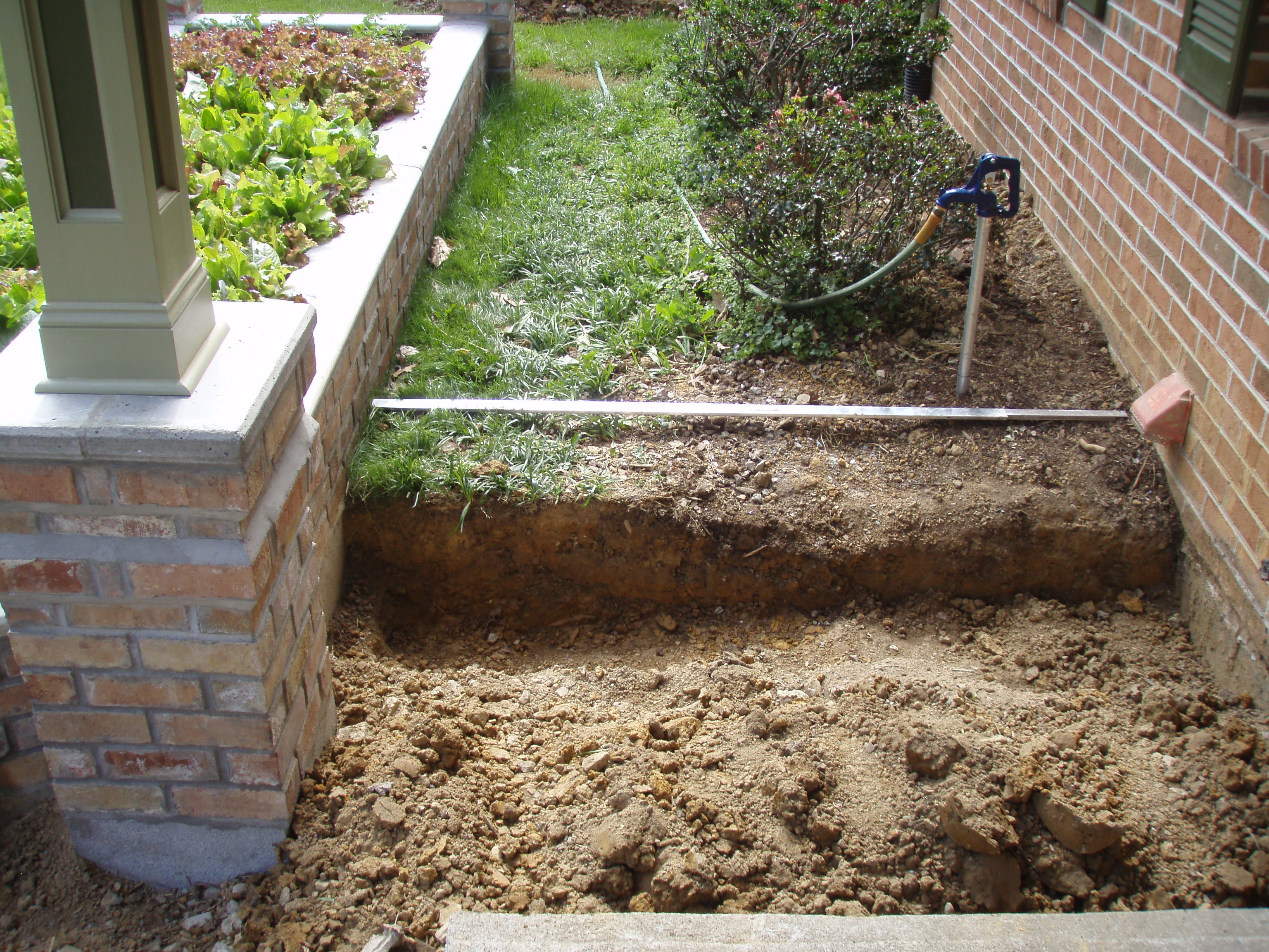 front gable porch with brick raised garden